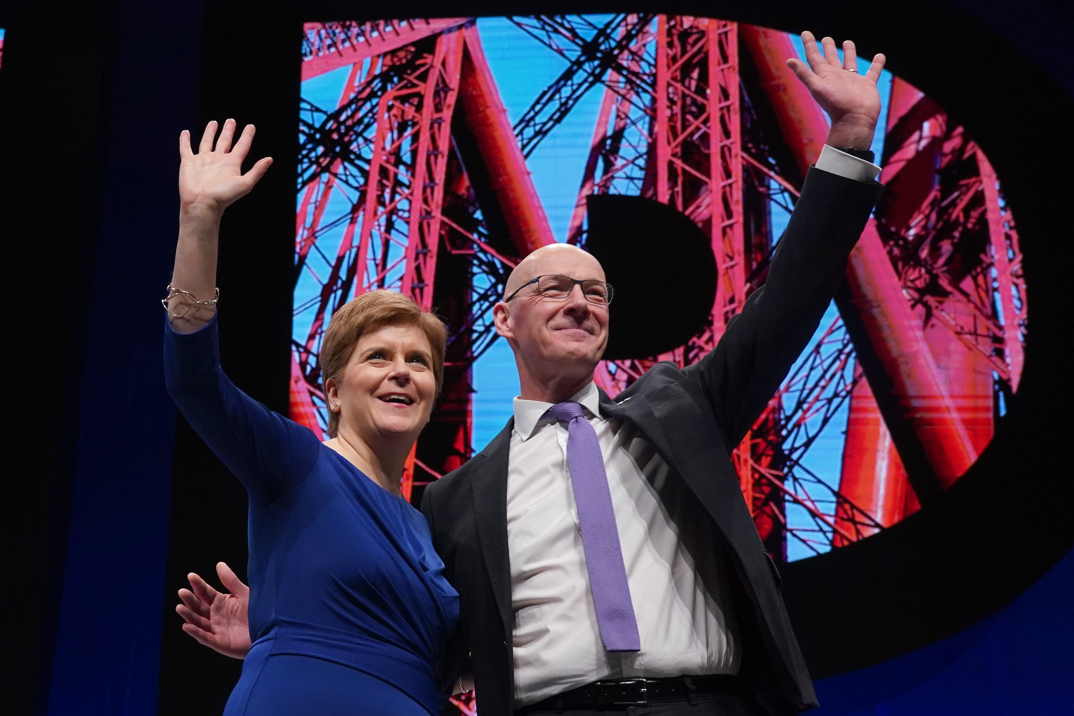 First Minister Nicola Sturgeon alongside Deputy First Minister John Swinney, who said he would not run in the race to replace her (Andrew Milligan/PA)