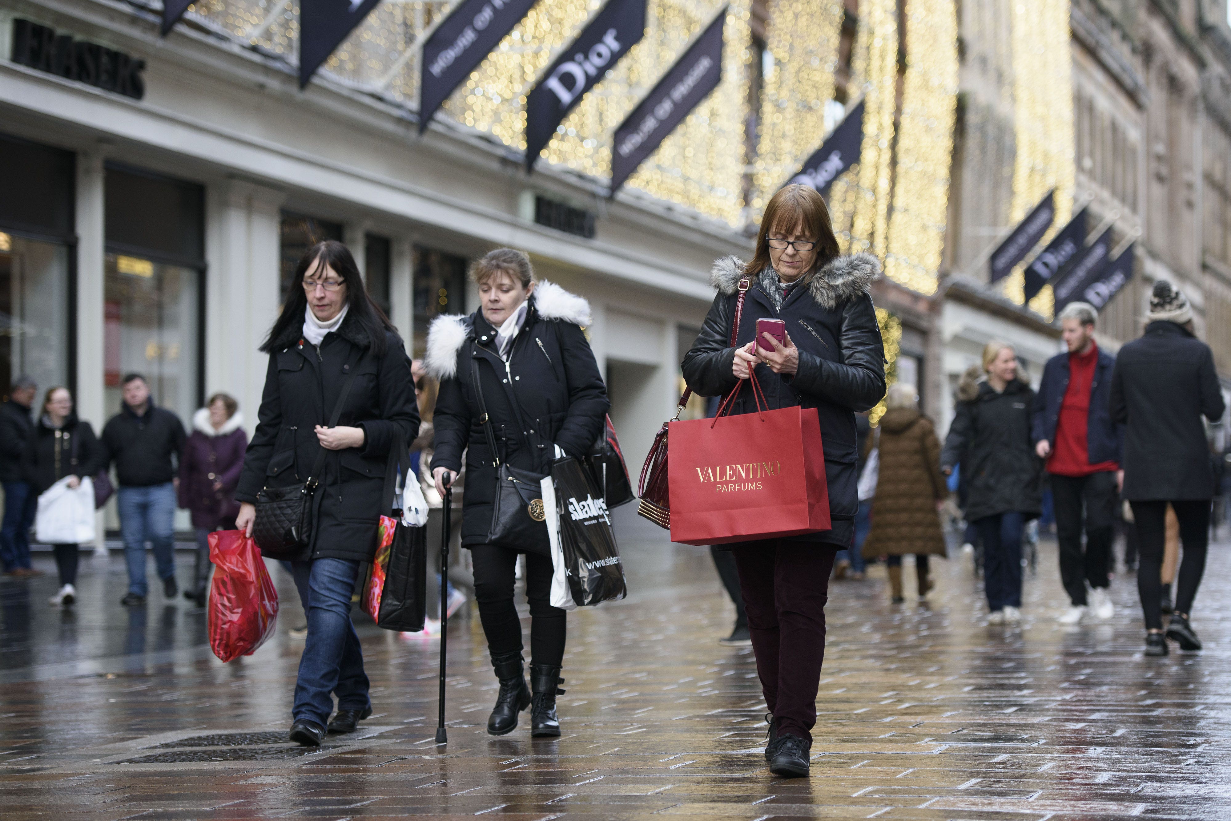 Shoppers on Buchanan Street in Glasgow city centre. Retailers saw sales improve last month amid demand for jewellery and furnishings (John Linton/PA)