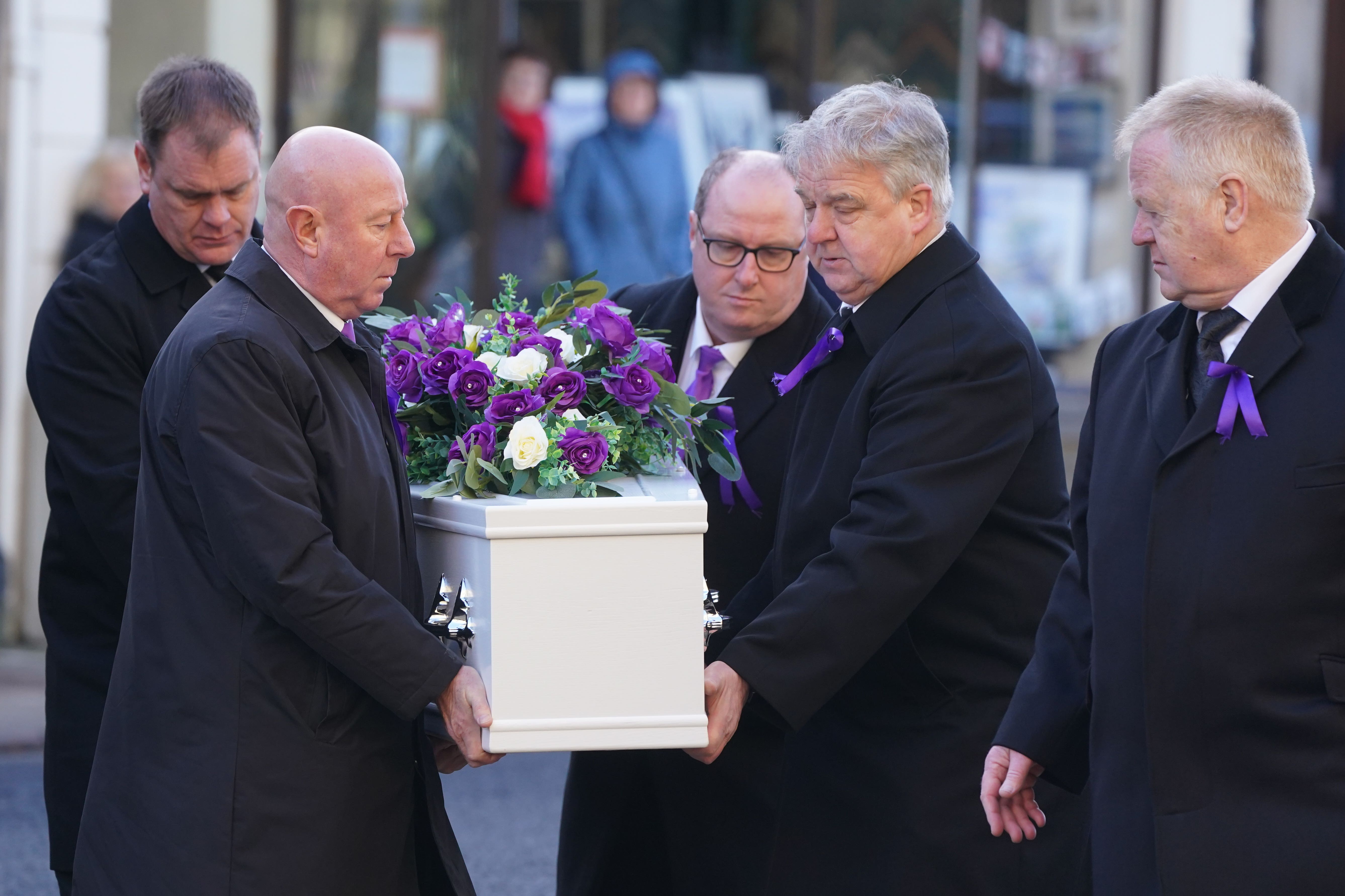 The coffin of Holly Newton is carried into Hexham Abbey (Owen Humphreys/PA)