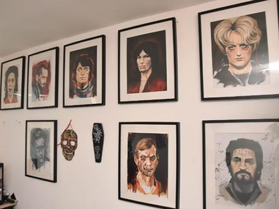 Pictures of serial killers on the bedroom wall of Shaye Groves, shown to the jury