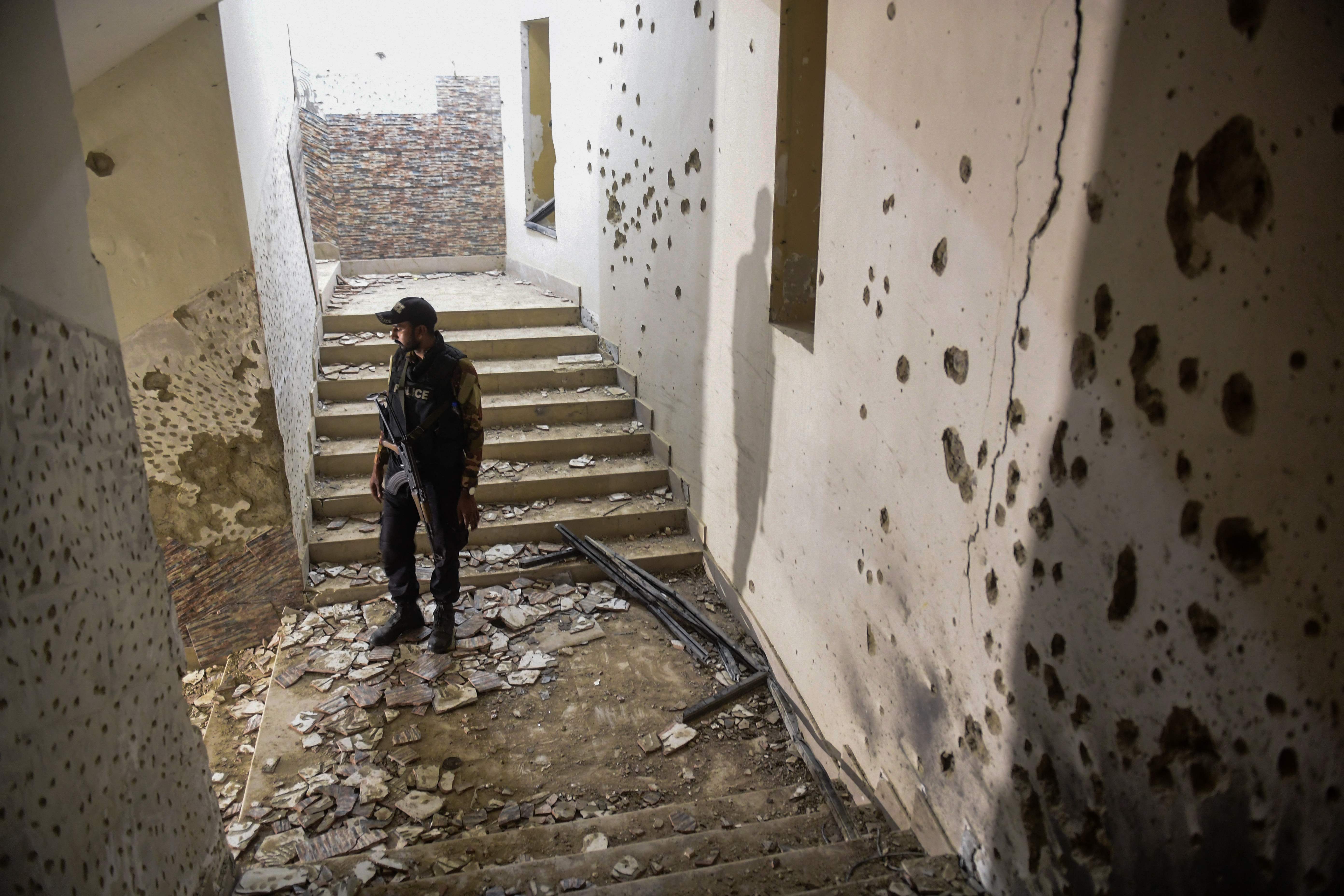 The bullet-marked police station in Karachi after the attack