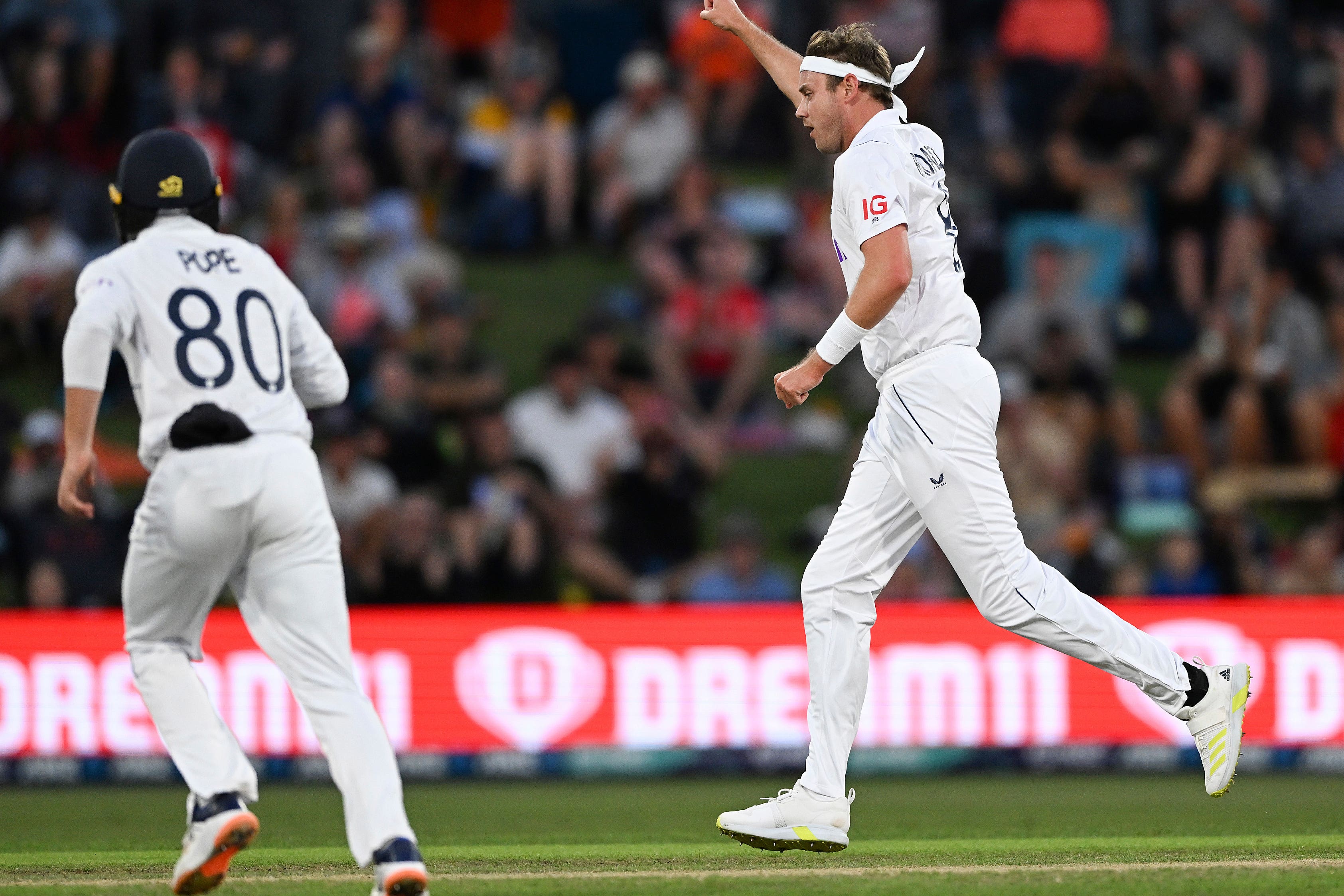 Stuart Broad, right, celebrates the wicket of New Zealand’s Devon Conway (Andrew Cornaga/Photosport via AP)