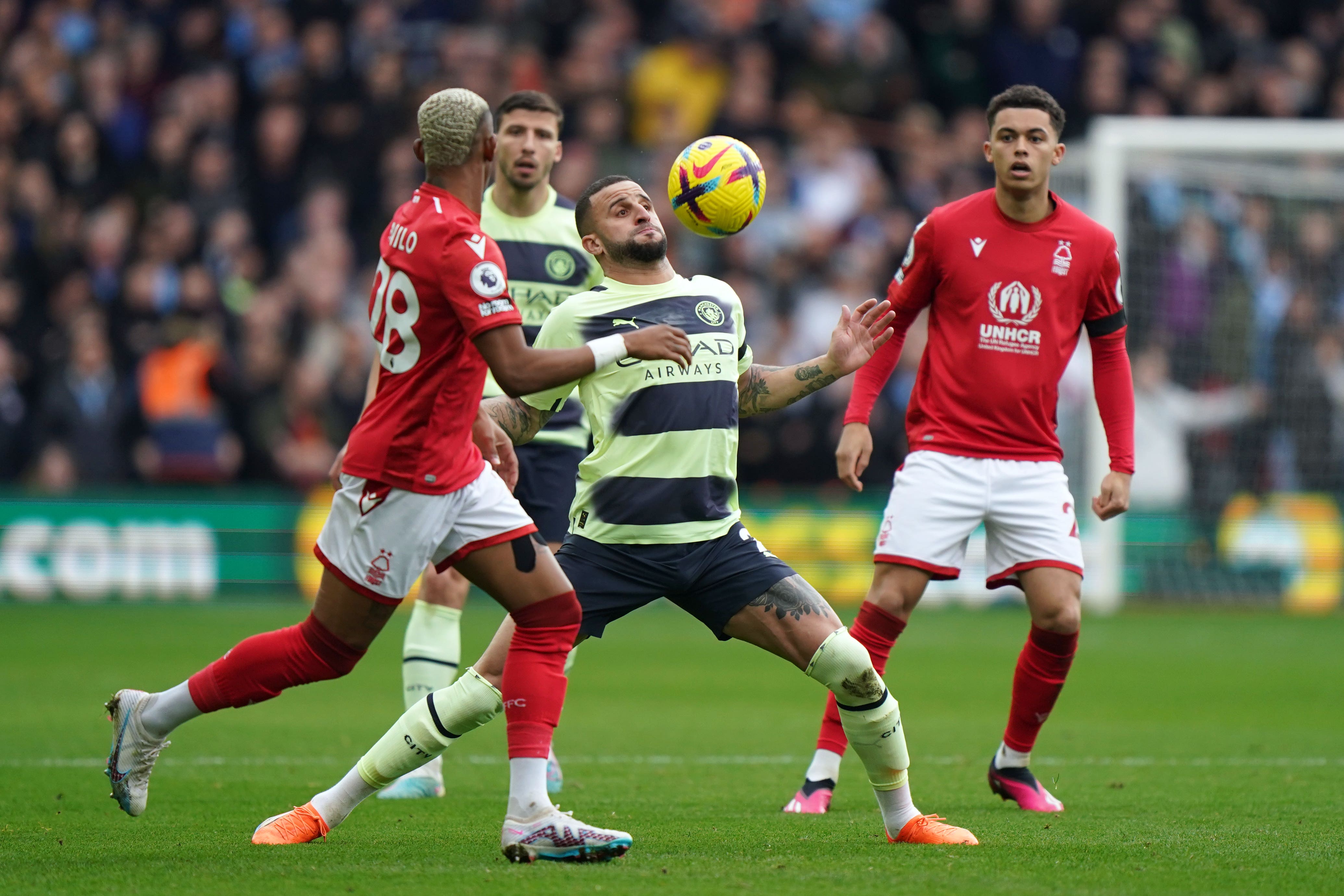 Manchester City’s Kyle Walker (centre) and Nottingham Forest’s Danilo (left) battle for the ball during the Premier League match at the City Ground, Nottingham. Picture date: Saturday February 18, 2023.