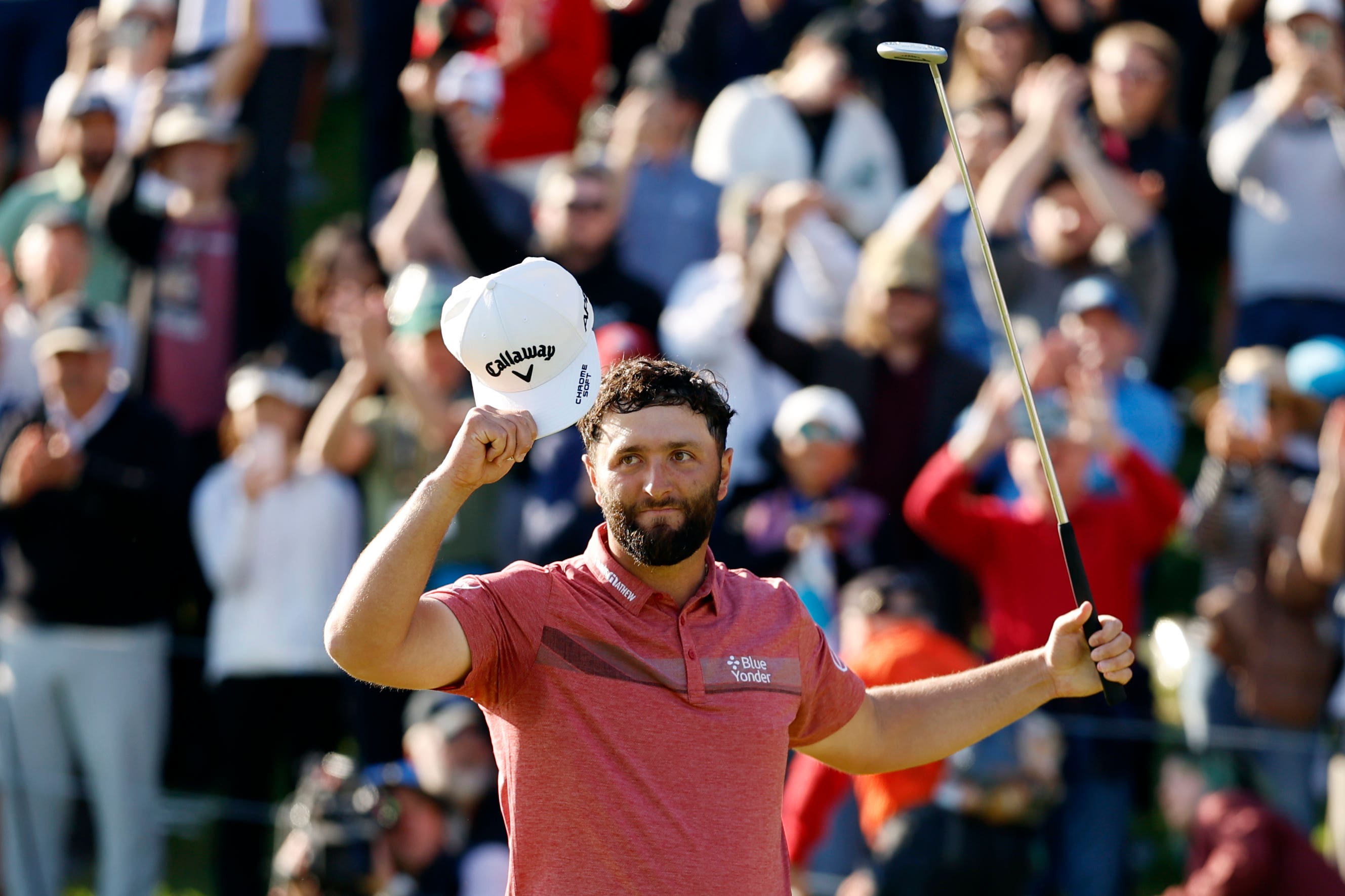 Rahm celebrates on the 18th green after winning the Genesis Invitational