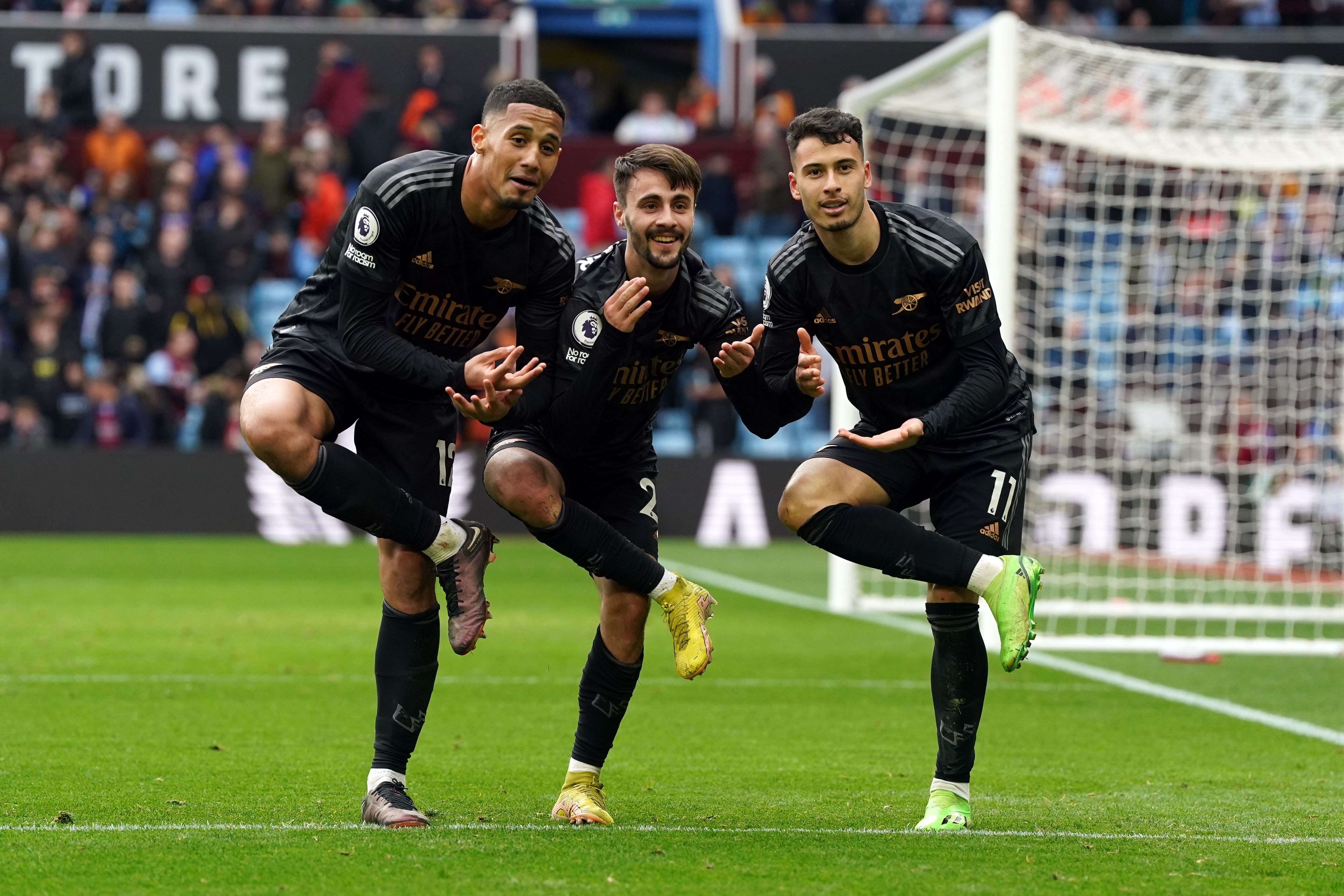 Arsenal’s Gabriel Martinelli (right) celebrates scoring his side’s fourth goal in the 4-2 win at Aston Villa with William Saliba (left) and Fabio Vieira (Nick Potts/PA)