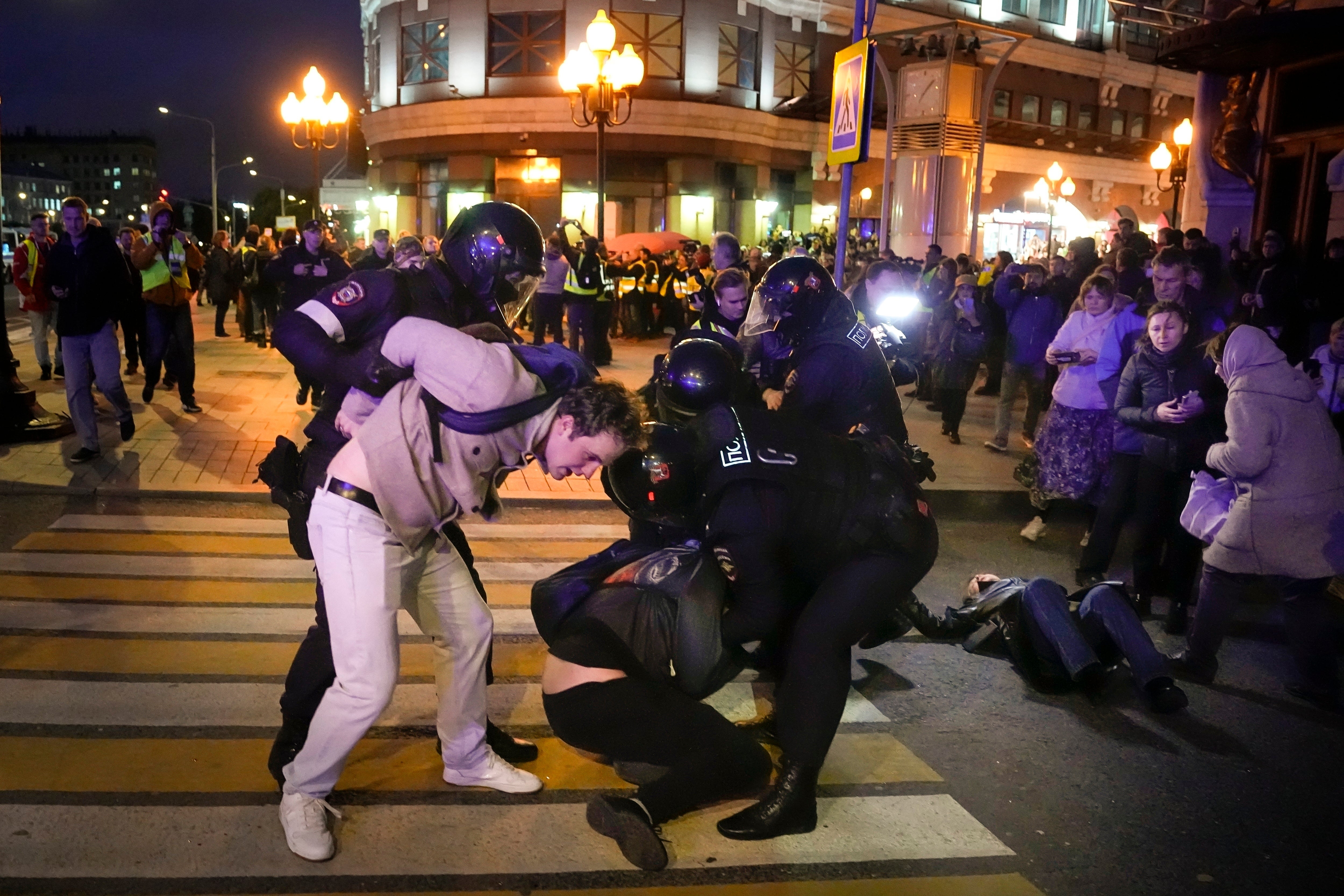 Riot police detain demonstrators during a protest against mobilisation in Moscow in September