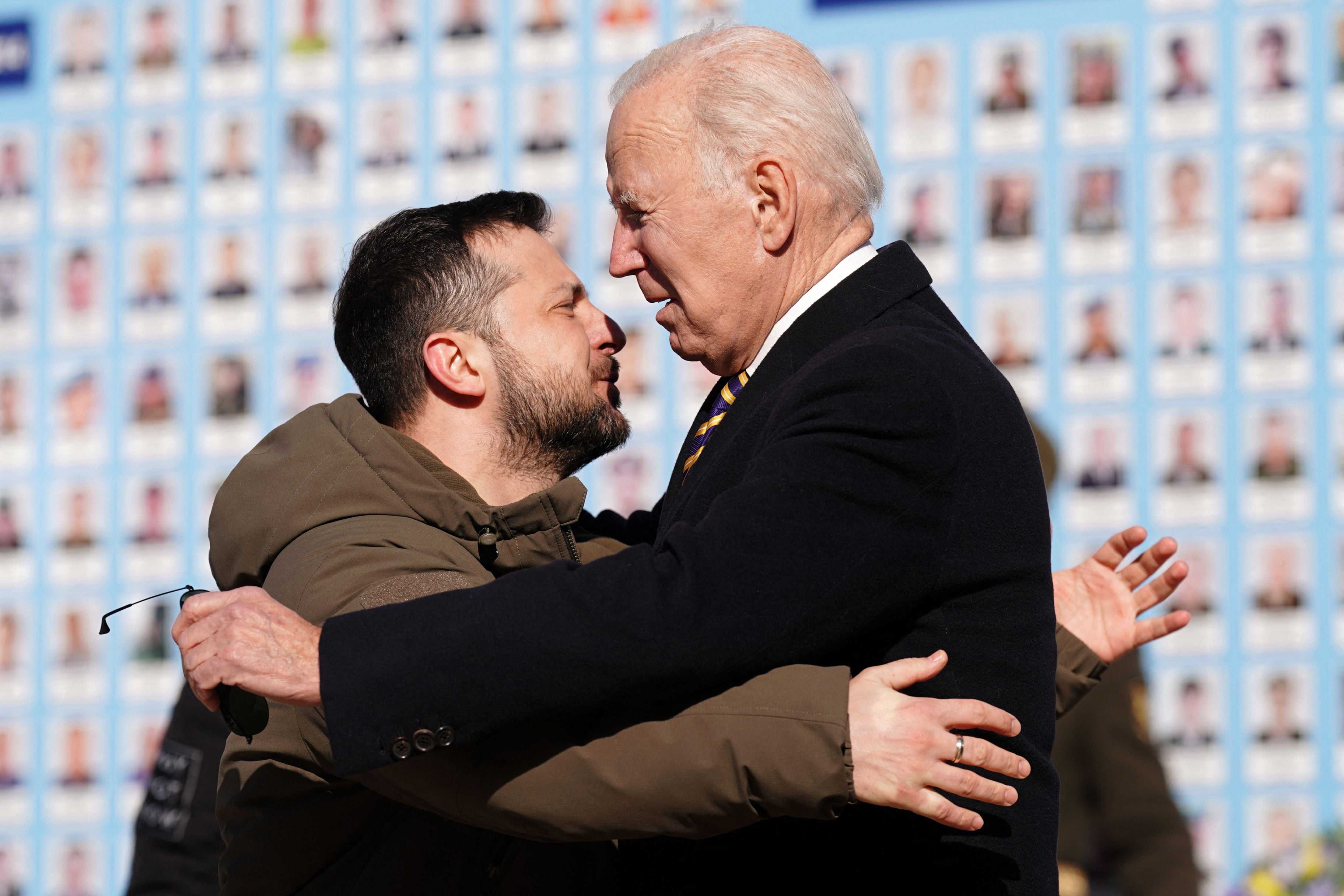 The two leaders embrace each other as Mr Biden arrives in the war-torn nation