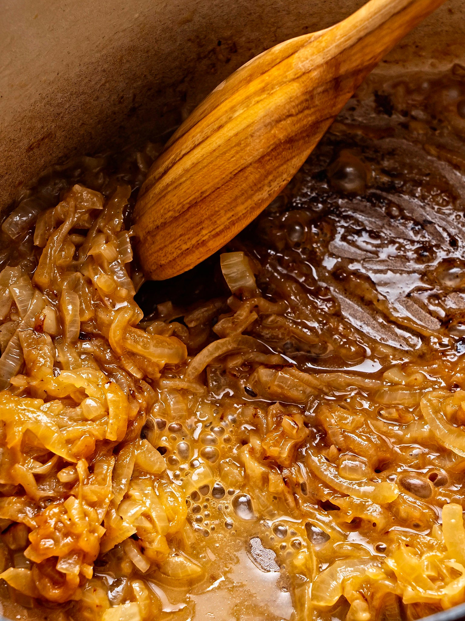 Add the port to deglaze by scraping up any browned bits stuck to the bottom of the pot