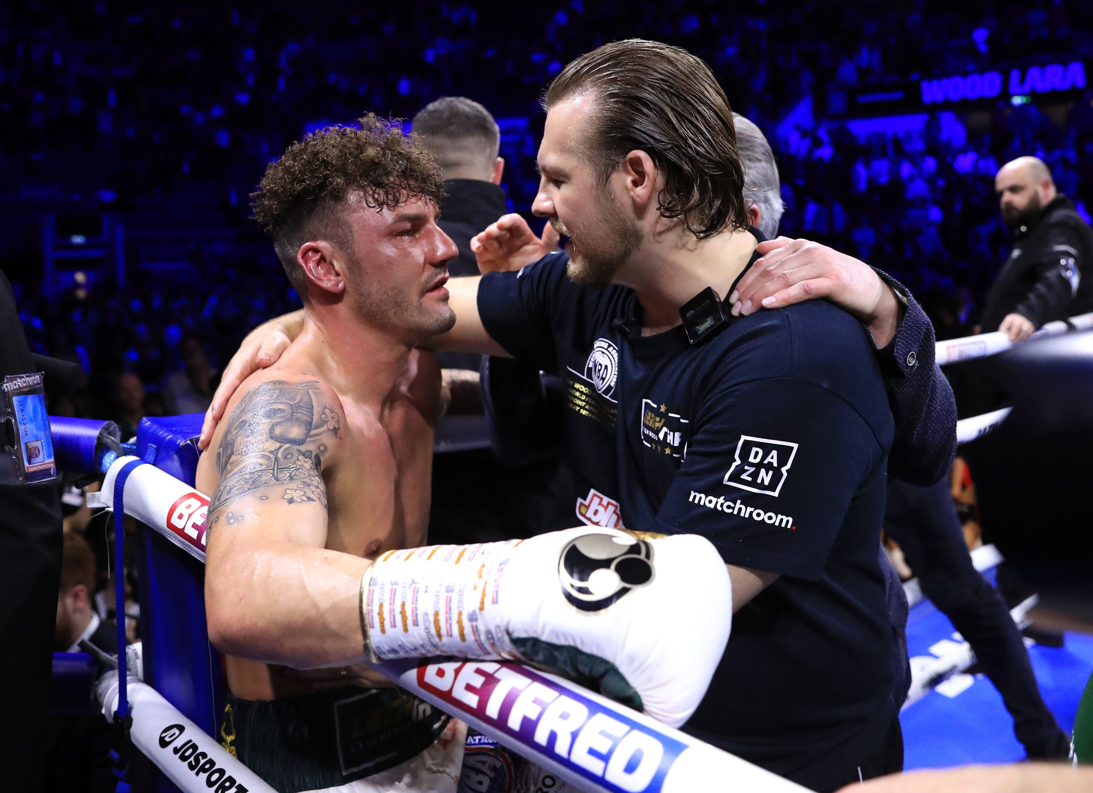 Ben Davison consoled his fighter after throwing in the towel during the title fight