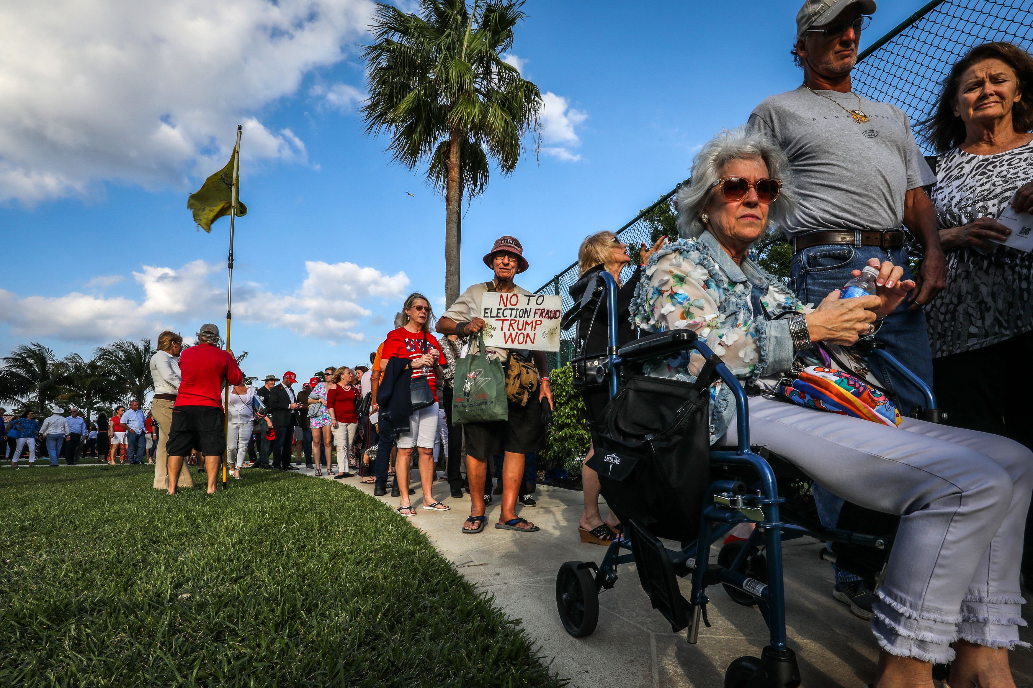 Supporters of former US President Donald Trump wait outside of Trump's President Day event at the Hilton Palm Beach Airport in West Palm Beach, Florida, on February 20, 2023