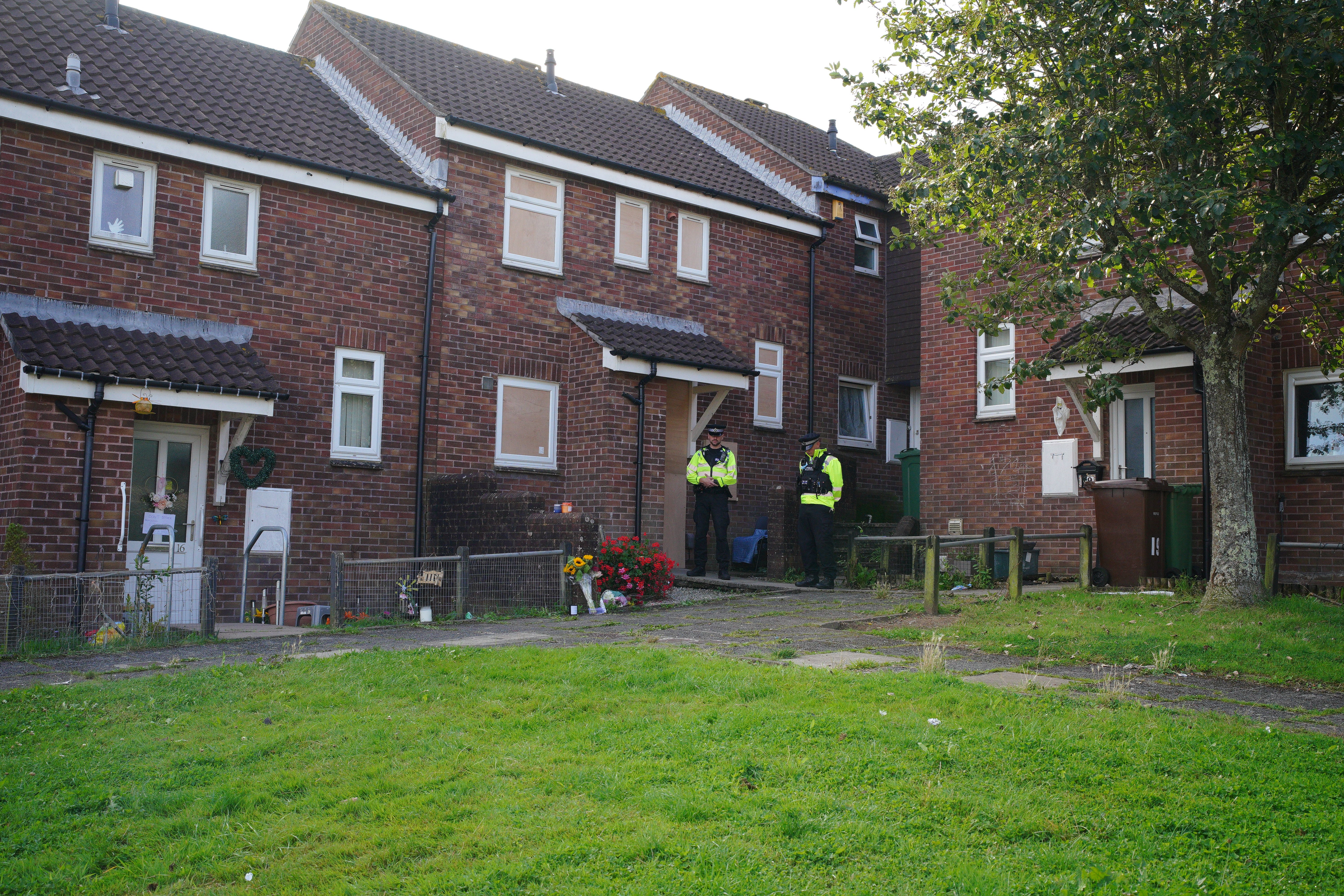 Floral tributes left in Biddick Drive, Keyham in Plymouth, Devon, where five people were killed by gunman Jake Davison in a firearms incident on Thursday evening. Picture date: Monday August 16, 2021.