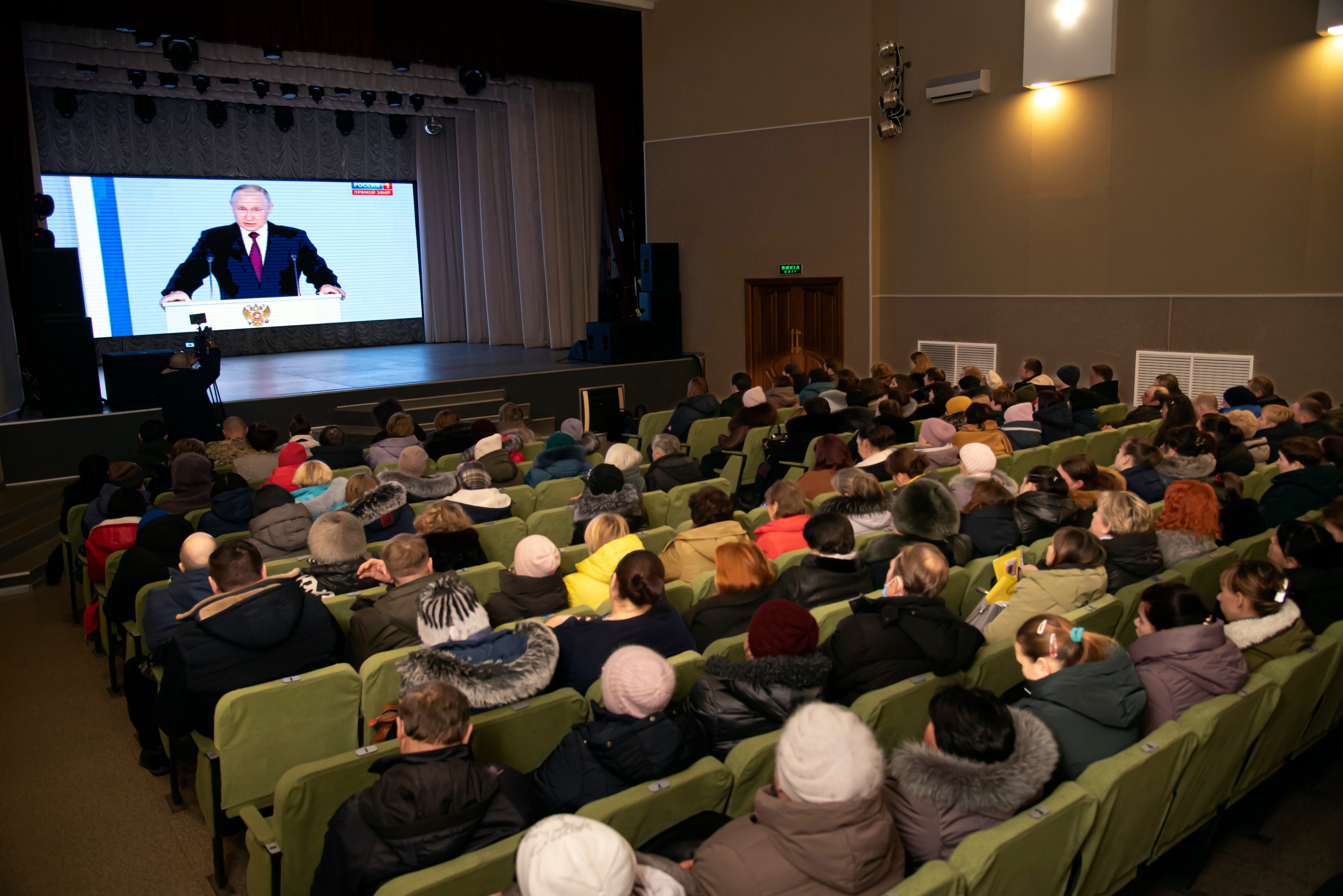 Residents in Russian-controlled Luhansk, eastern Ukraine, watching Putin speak on Tuesday