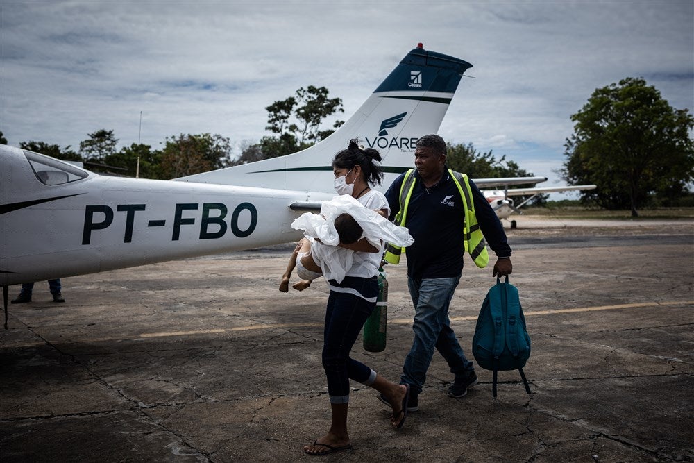 A Yanomami boy receives assistance upon arrival at an airport in the city of Boa Vista last month