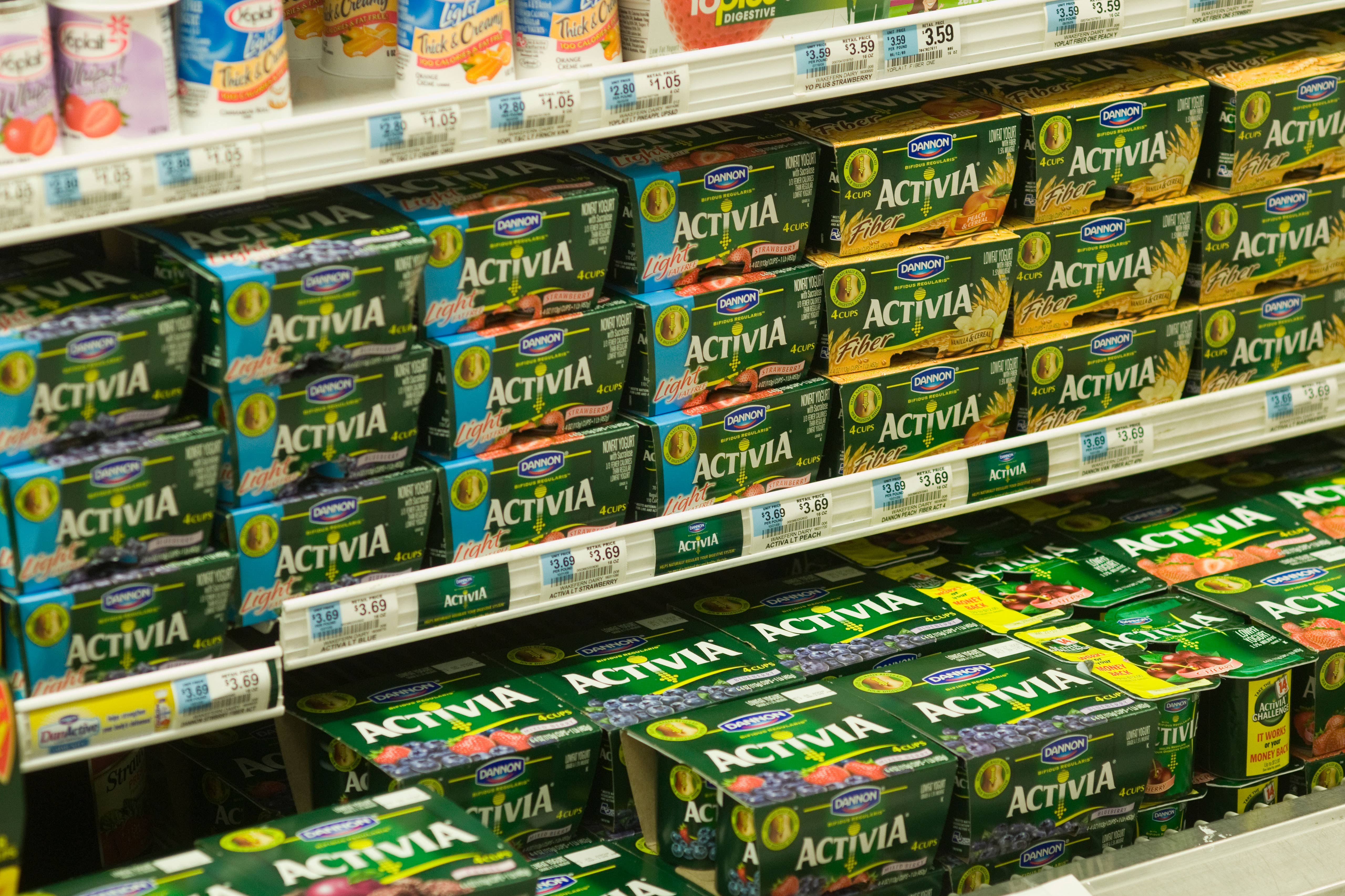 Containers of Danone Activia Yogurt are seen on a supermarket shelf (Alamy/PA)