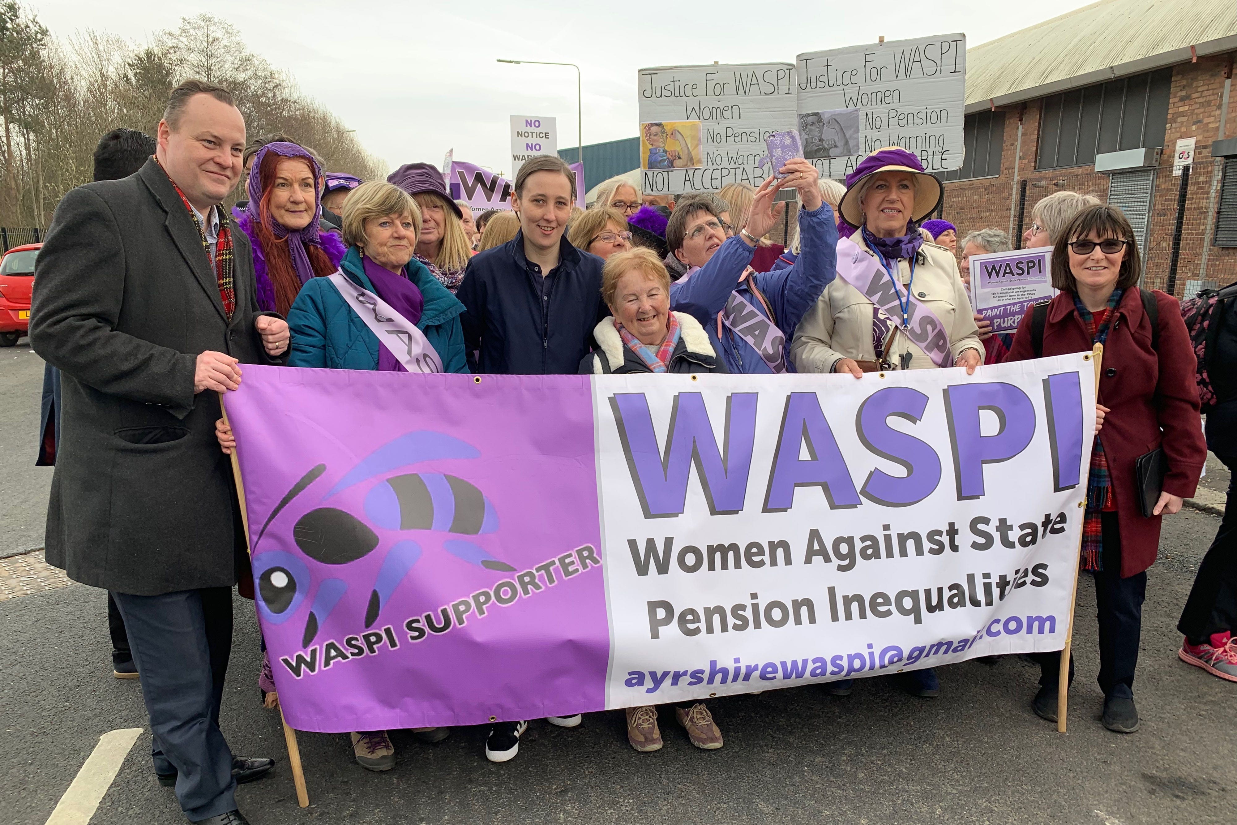 People taking part in a demonstration in Glasgow calling for an end to state pension inequality (Lewis McKenzie/PA)