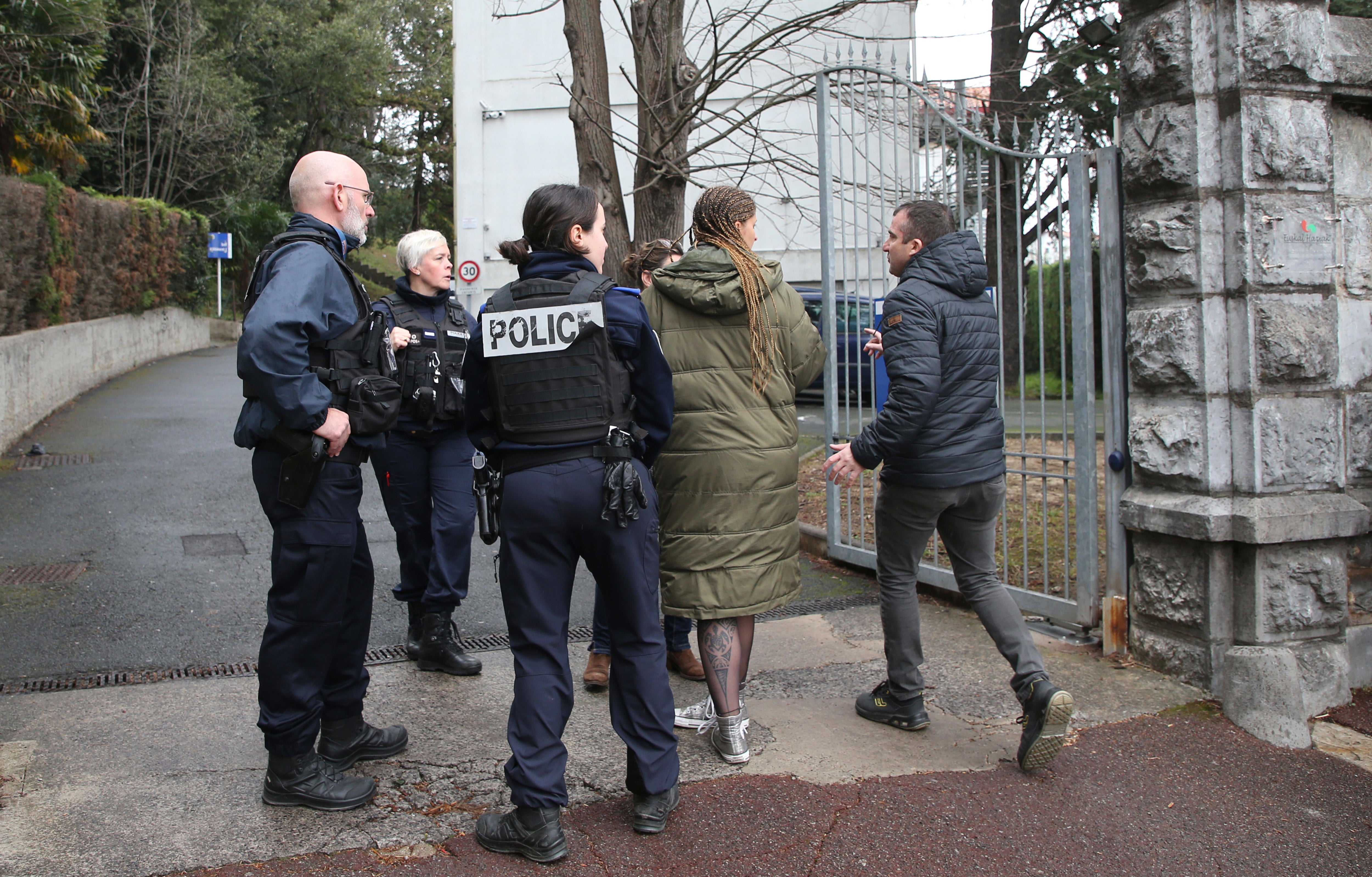 Police outside the school after a teacher was stabbed to death