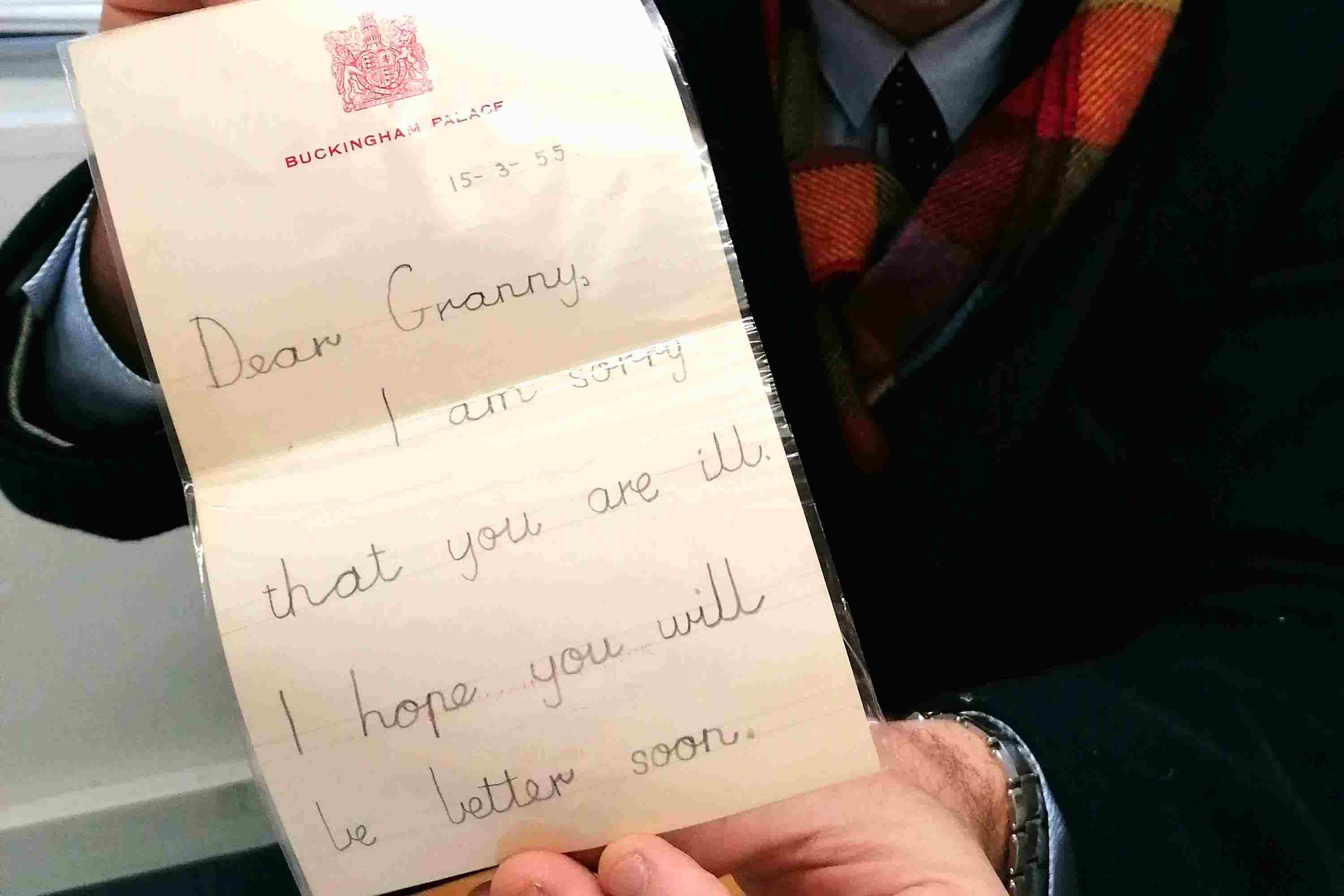 Charles Hanson, owner of Hansons Auctioneers, holding up the letter written by a six-year-old Prince Charleswith the childhood letter from Prince Charles (Hansons Auctioneers/PA)