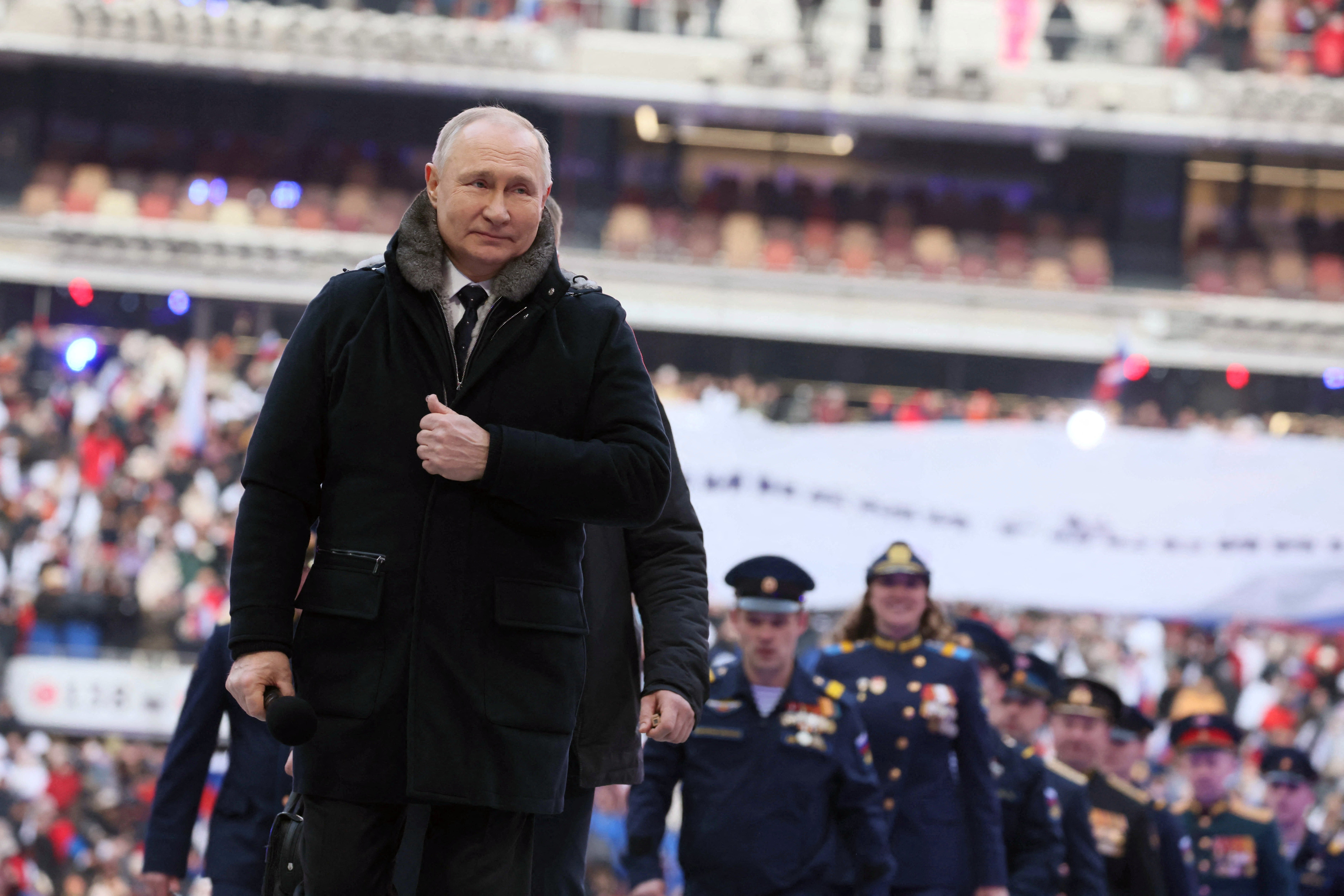 Vladimir Putin attends a concert for Russian service members in Moscow on Wednesday.