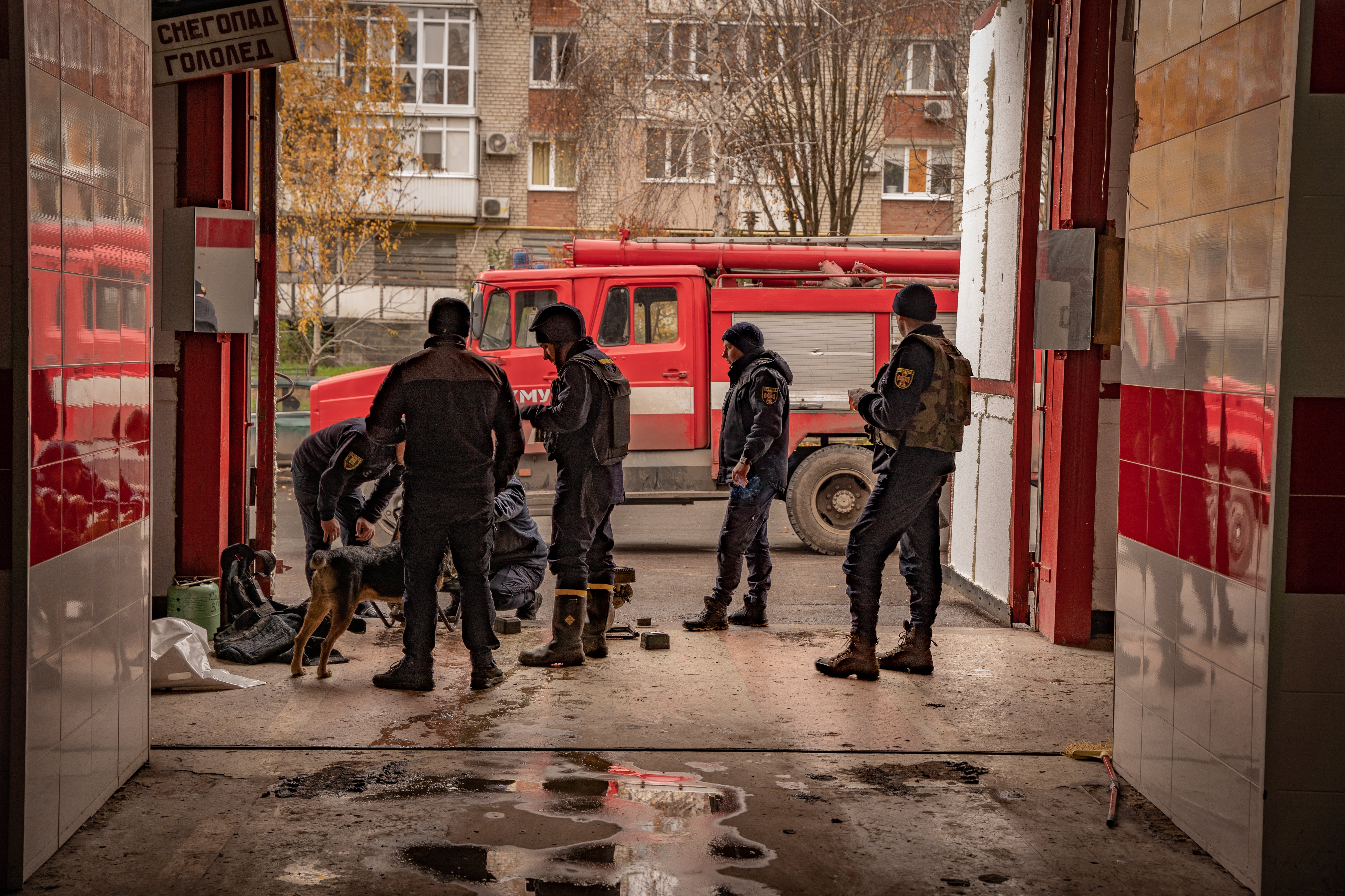 Fire fighters in Bakhmut a frontline town in Donbas wait for a call - the fire department was struck by shelling days later. (October)