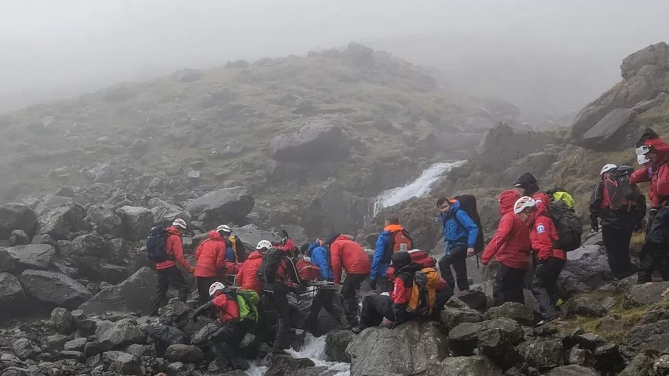 Rescue teams take walker down from ridge