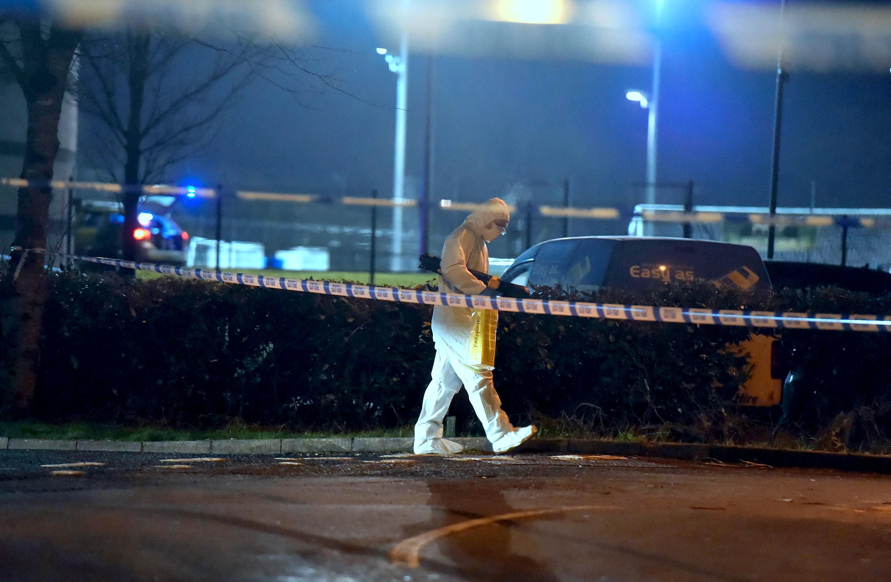 A forensics officer at the scene of a shooting in the Killyclogher Road area