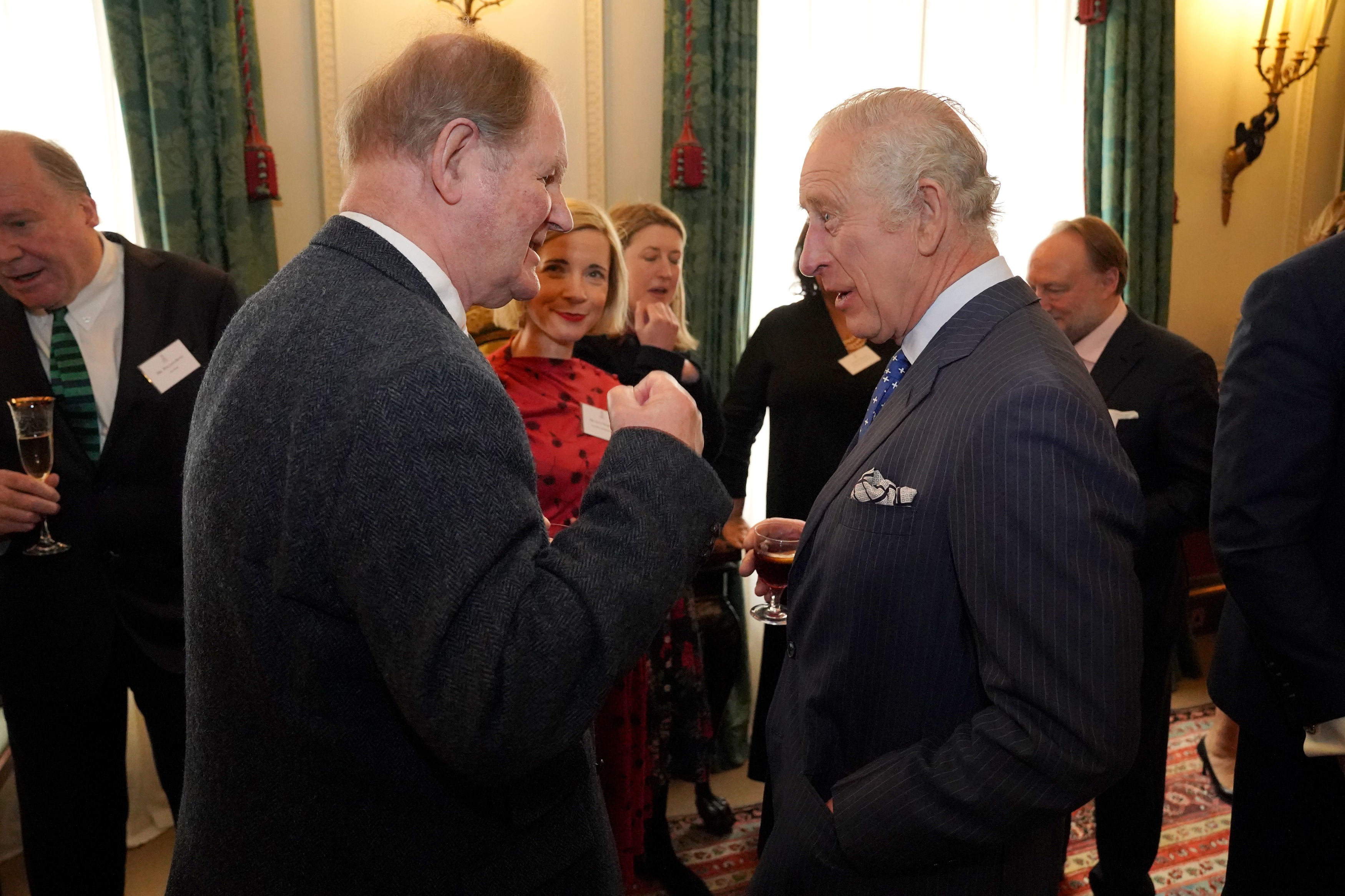 The King speaks to Michael Morpurgo at Clarence House