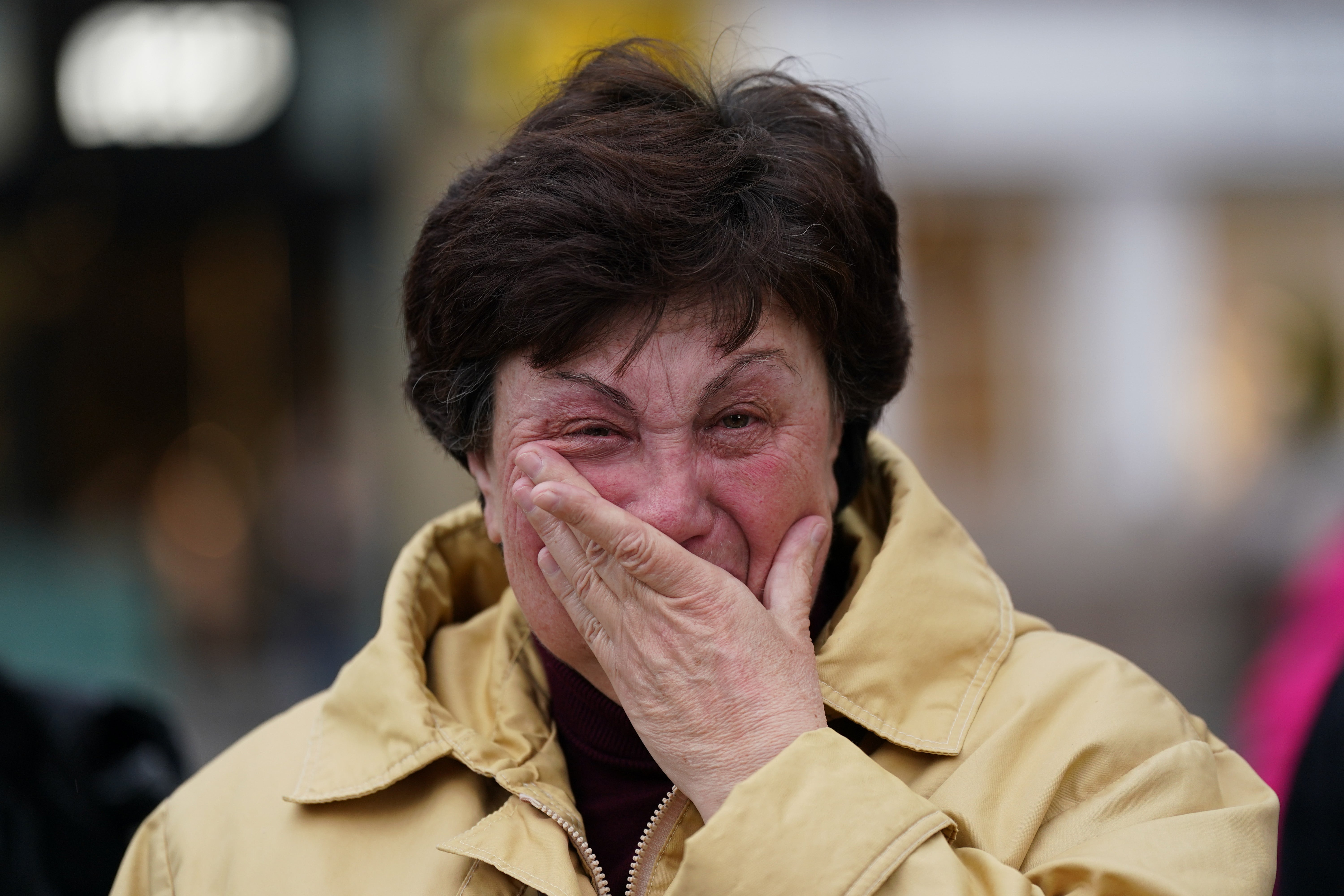 A woman weeps as members of northeast Ukrainian community groups gather at Grey’s Monument to mark the first anniversary of the Russian invasion of Ukraine in Newcastle upon Tyne, United Kingdom