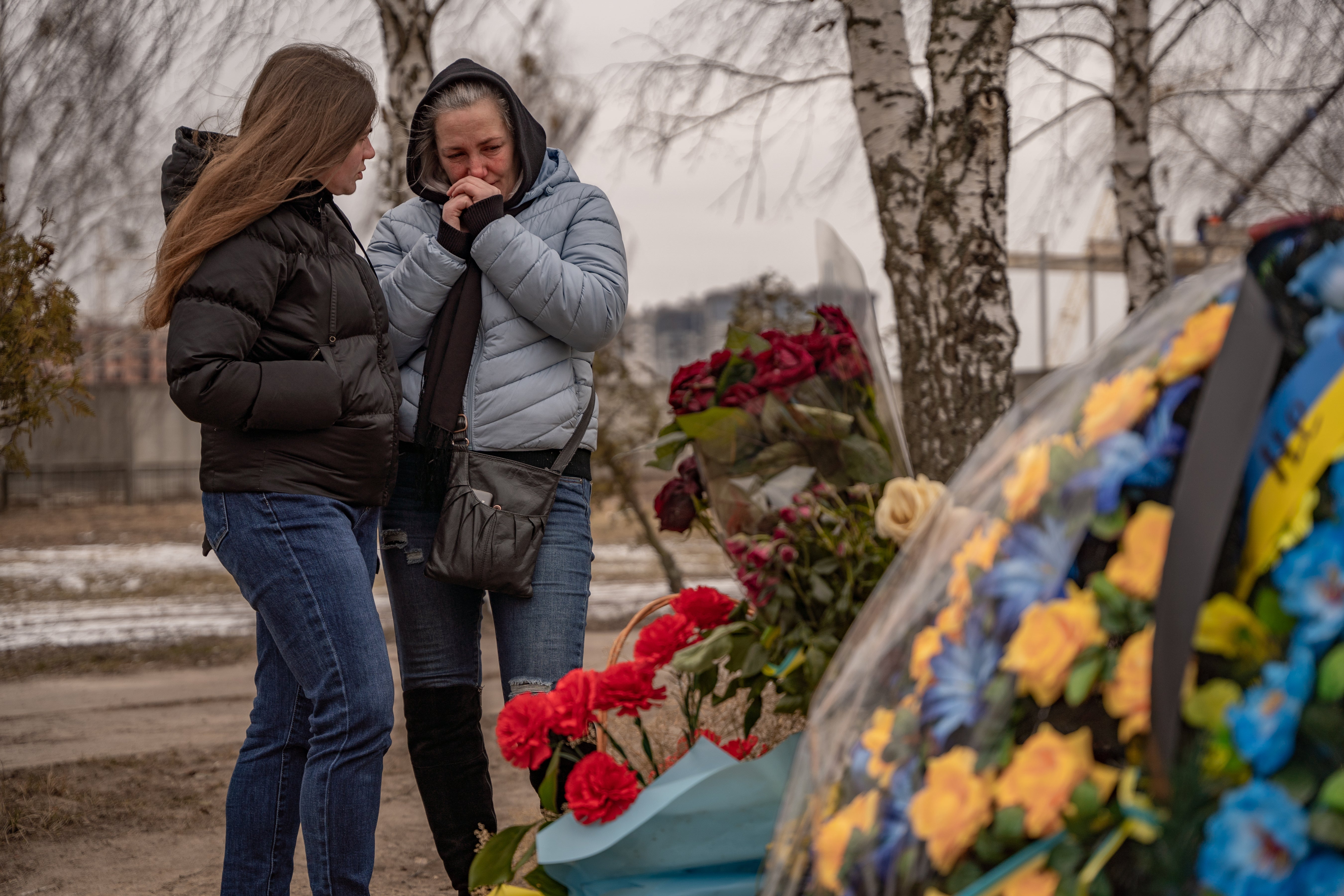 Anna, 24 comforts Tetiana, 47 who lost her son, Oleksy. Anna’s fiancee a soldier who died a month ago in Bakhmut