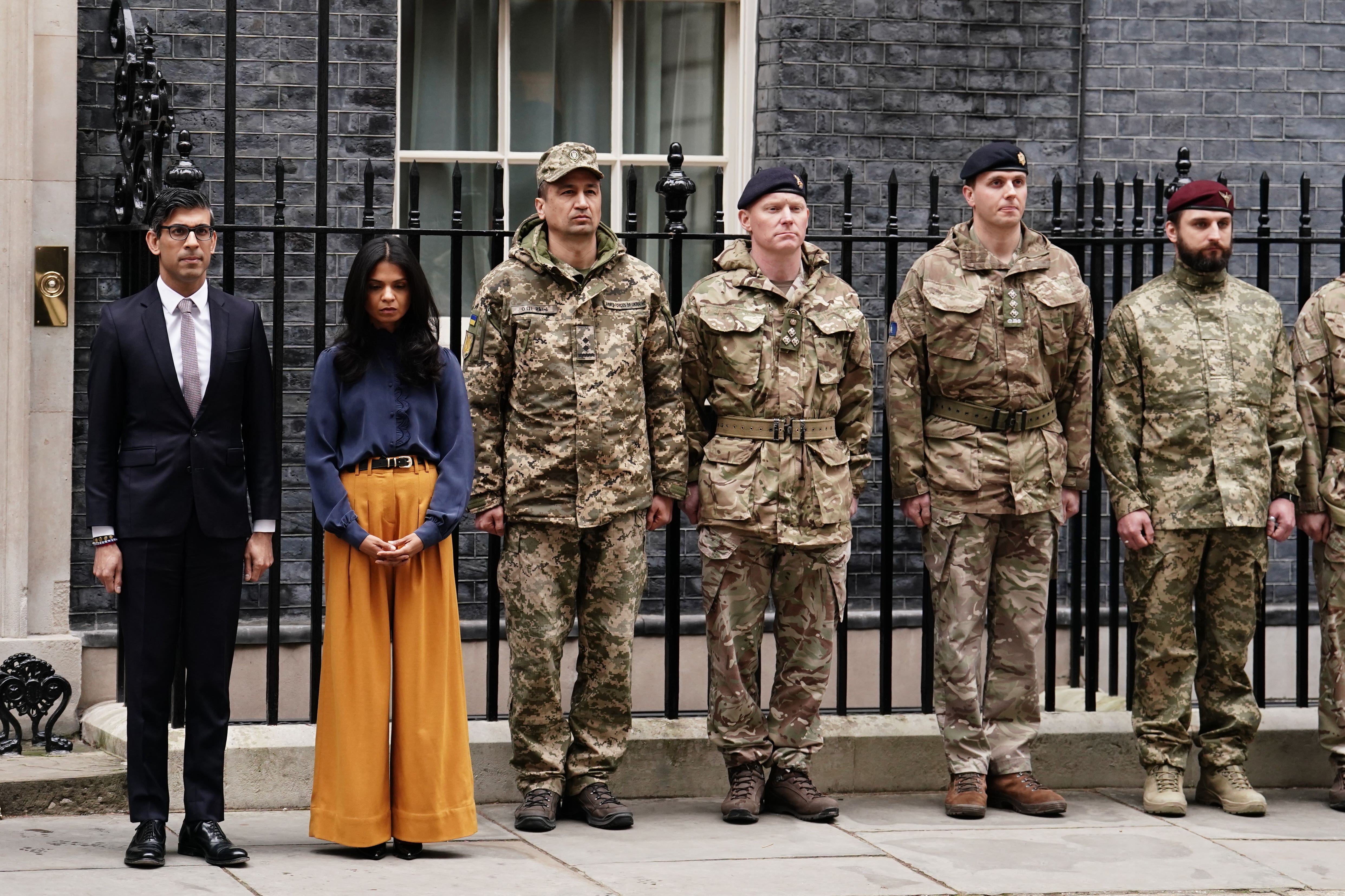 Rishi Sunak (left) and his wife Akshata Murty with members of the Ukrainian Armed Forces (Jordan Pettitt/PA)