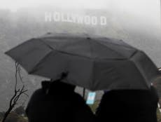 Southern California shivers in blizzard conditions as tornadoes threaten LA and 114,000 without power