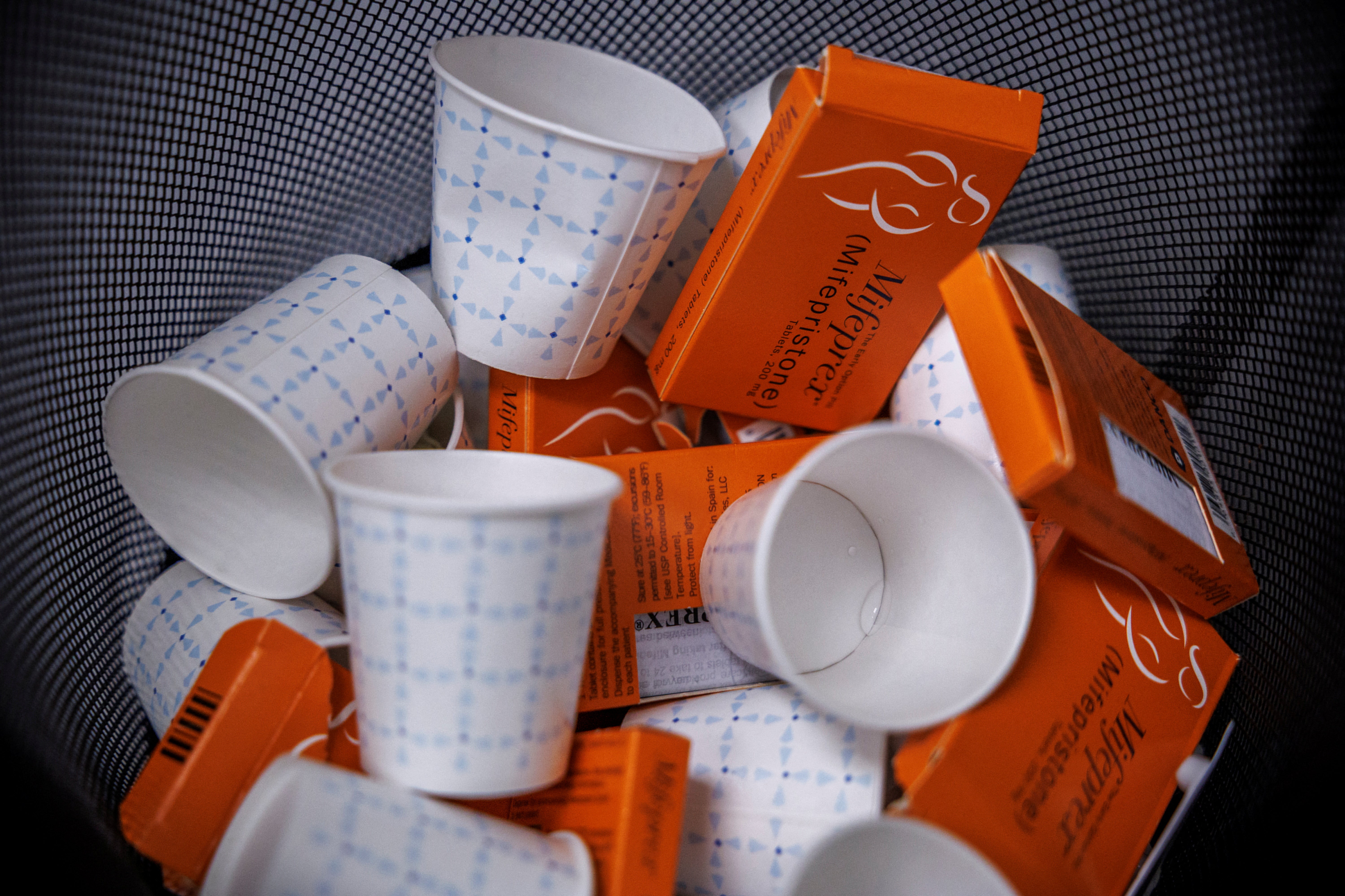 Used boxes of mifepristone pills, the first drug used in a two-drug medical abortion protocol, fill a bin at Alamo Women’s Clinic in Albuquerque, New Mexico.