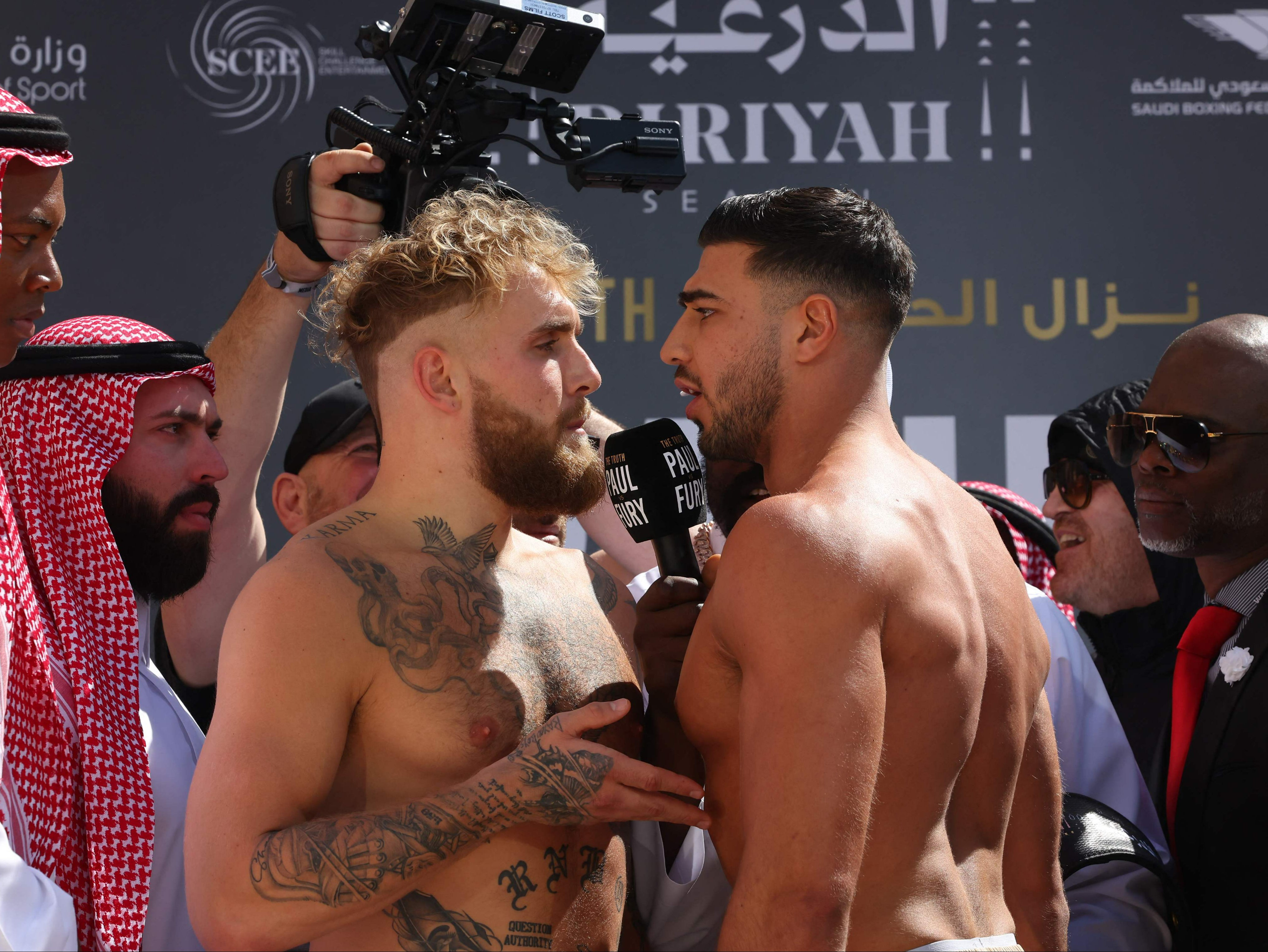 Tommy Fury and Jake Paul face off during the weigh-in event