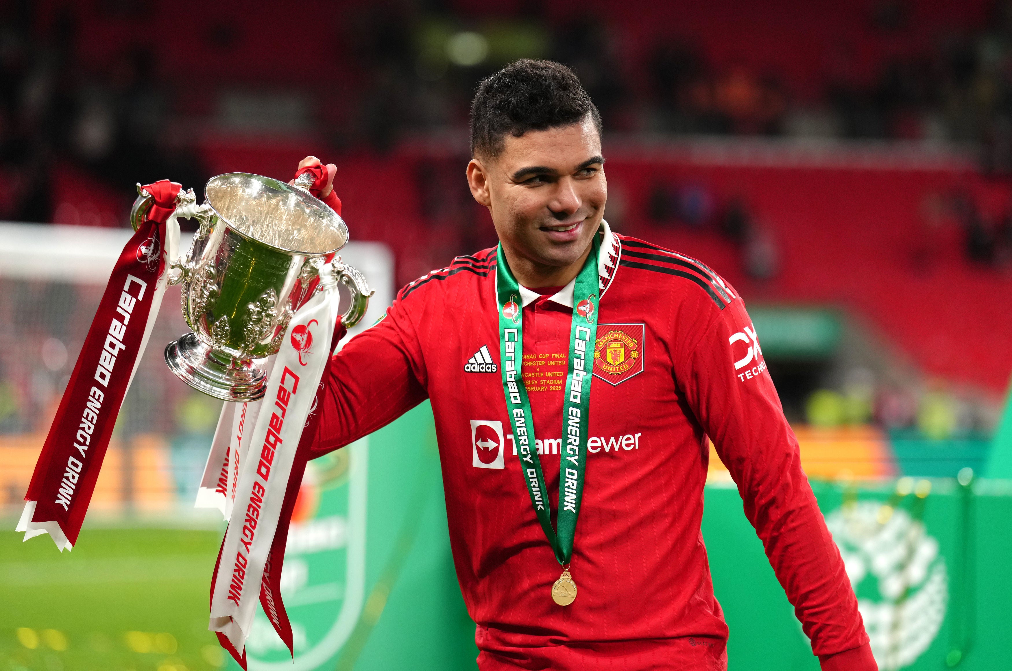 Casemiro celebrates with the trophy at Wembley