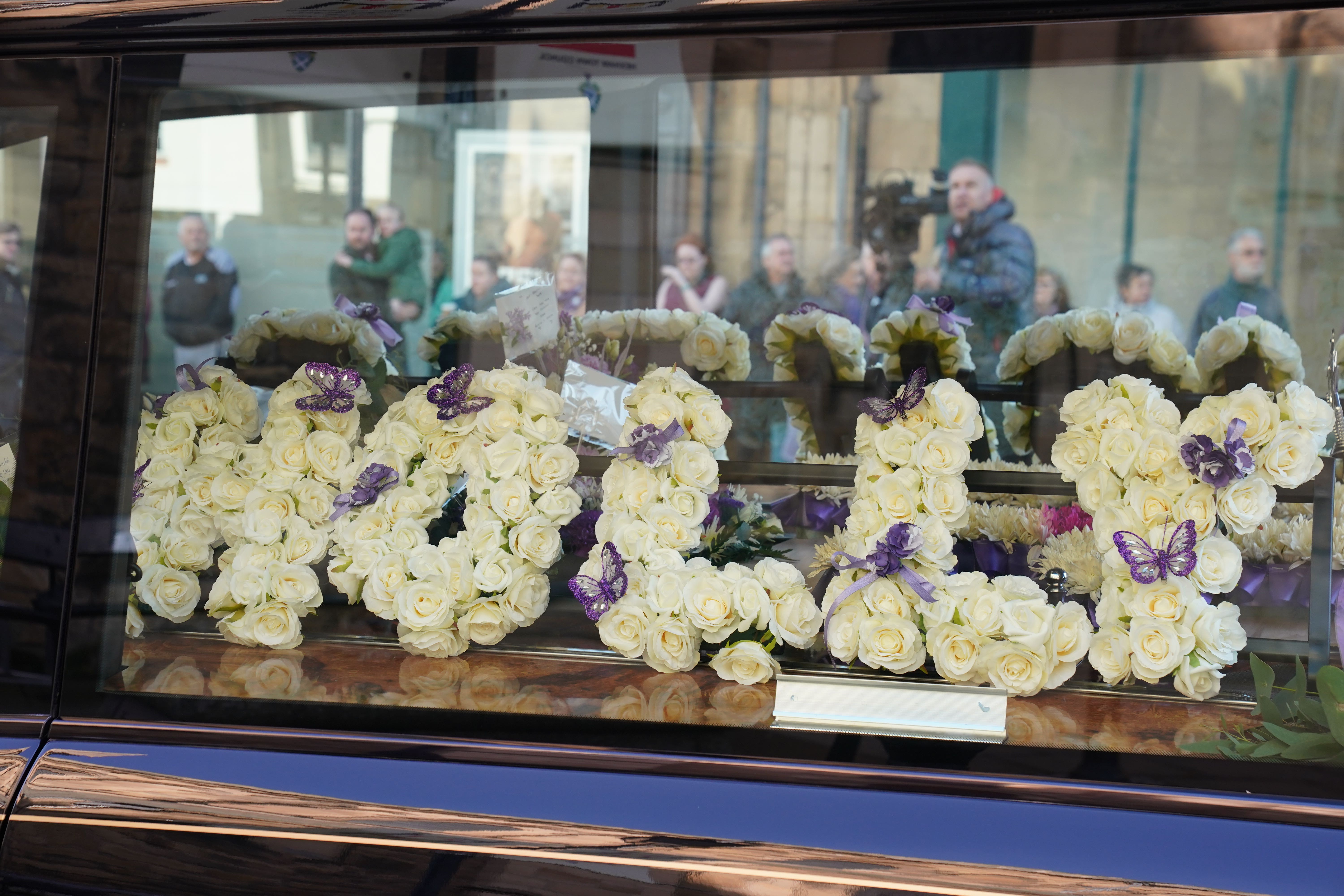 A floral tribute for the funeral of Holly Newton at Hexham Abbey