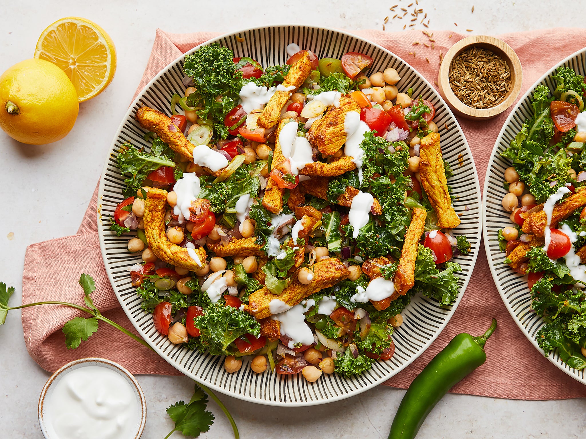 Spiced pork strips go well with vitamin-rich kale and juicy plum tomatoes