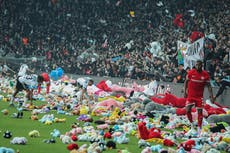 Besiktas and Antalyaspor football fans throw teddies onto pitch for earthquake victims