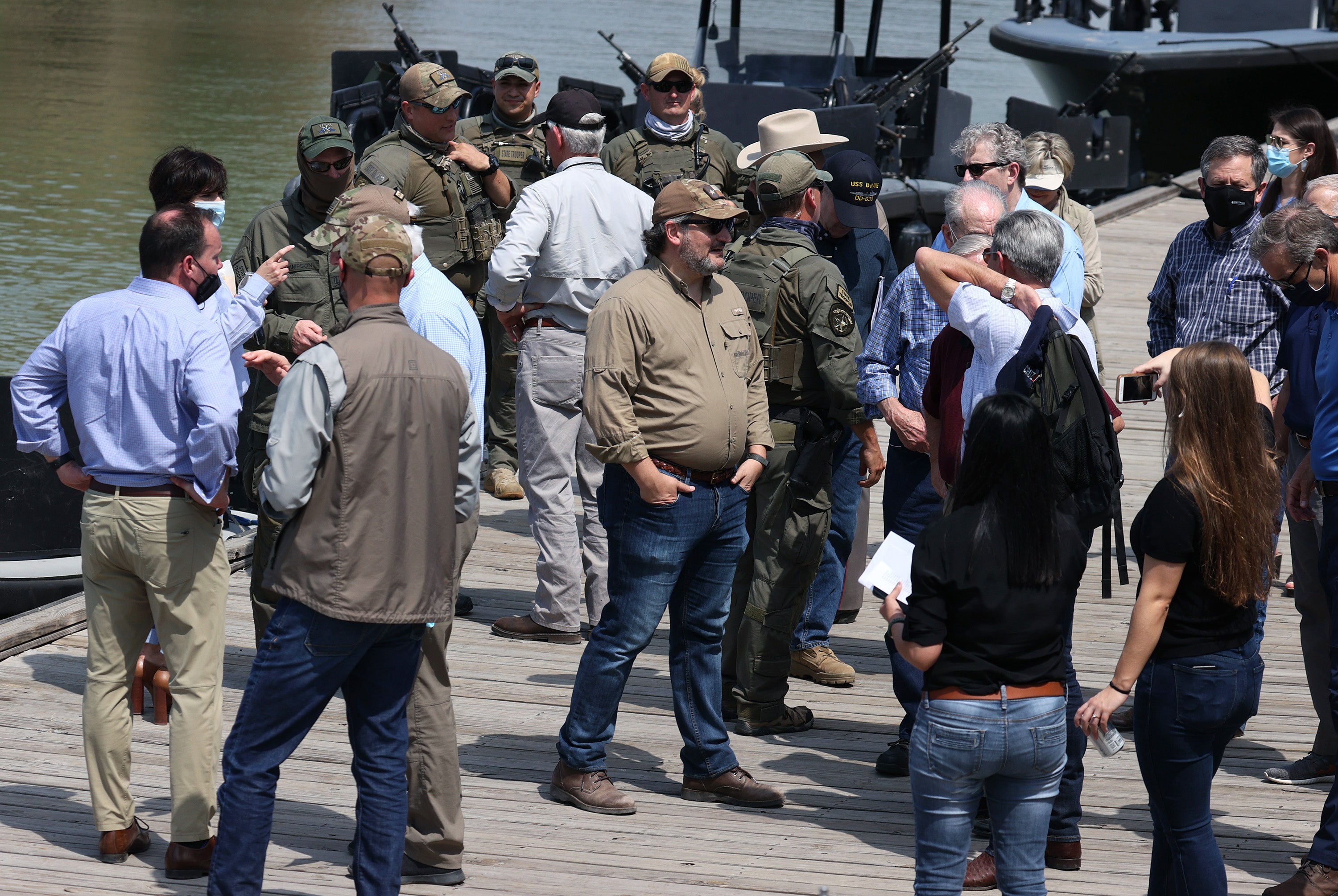 Sen. Ted Cruz (R-TX) (C) stands with other Senators after taking a tour of part of the Rio Grande river on a Texas Department of Public Safety boat on March 26, 2021 in Mission, Texas