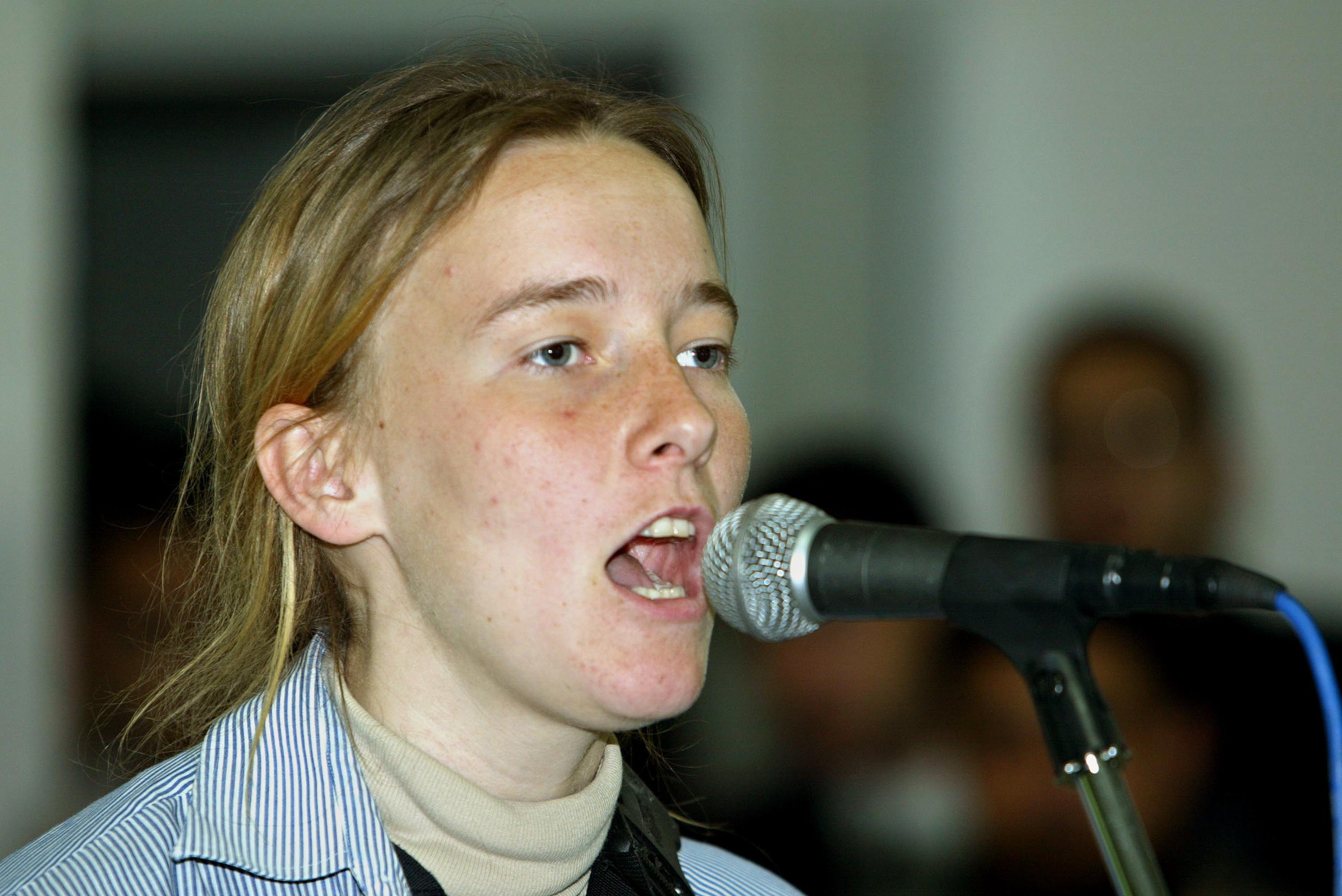 Corrie speaking at a mock trial of US President George W Bush in the Rafah refugee camp in the Gaza Strip in March 2003