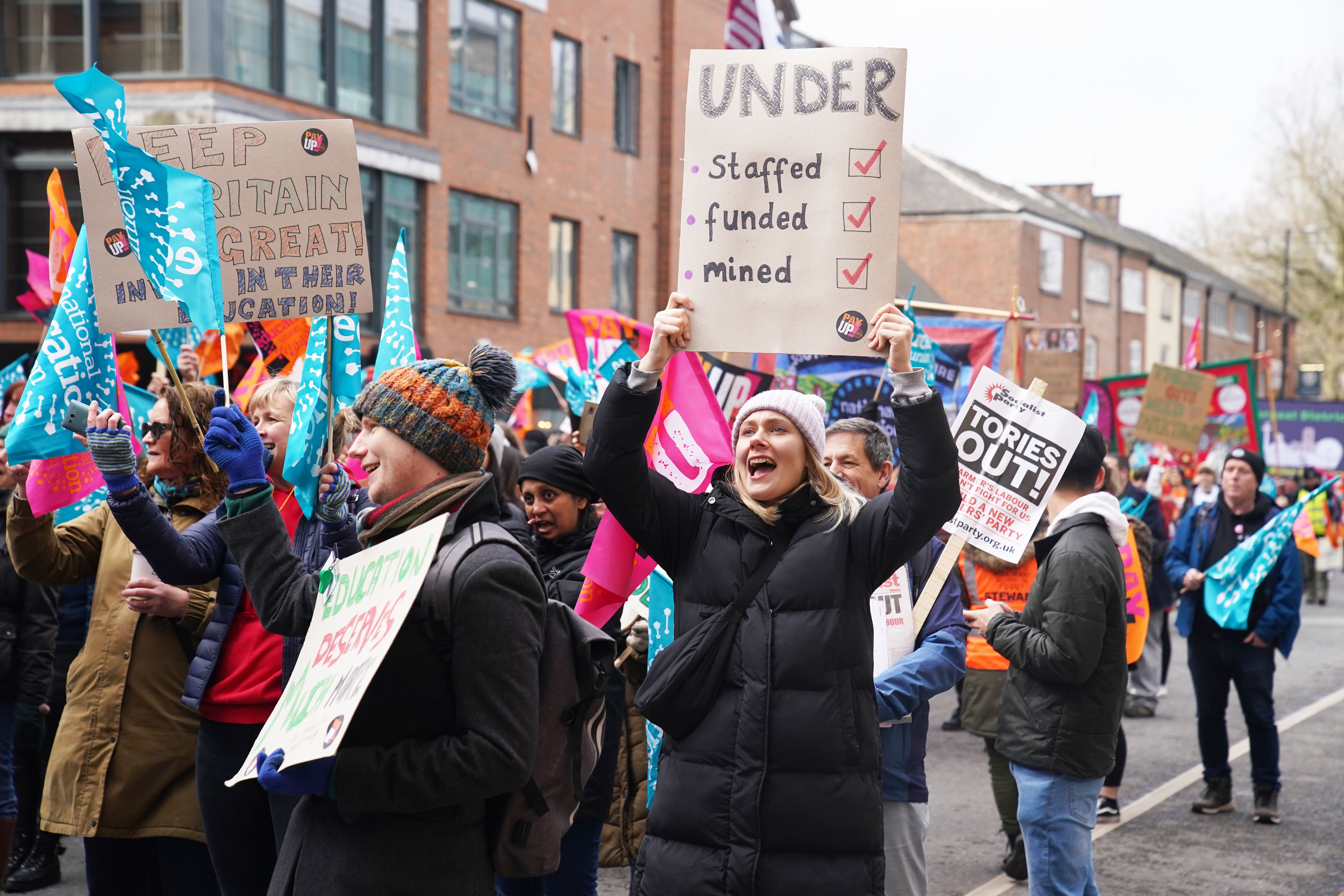 Members of the National Education Union (NEU) during a rally in Manchester