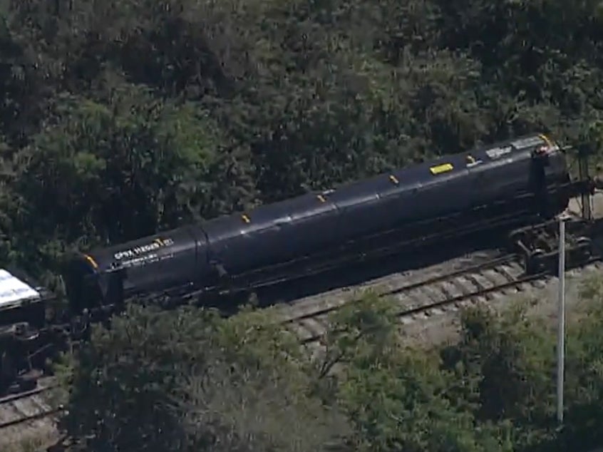 An overturned train tanker in Sarasota County, Florida, following a partial train derailment