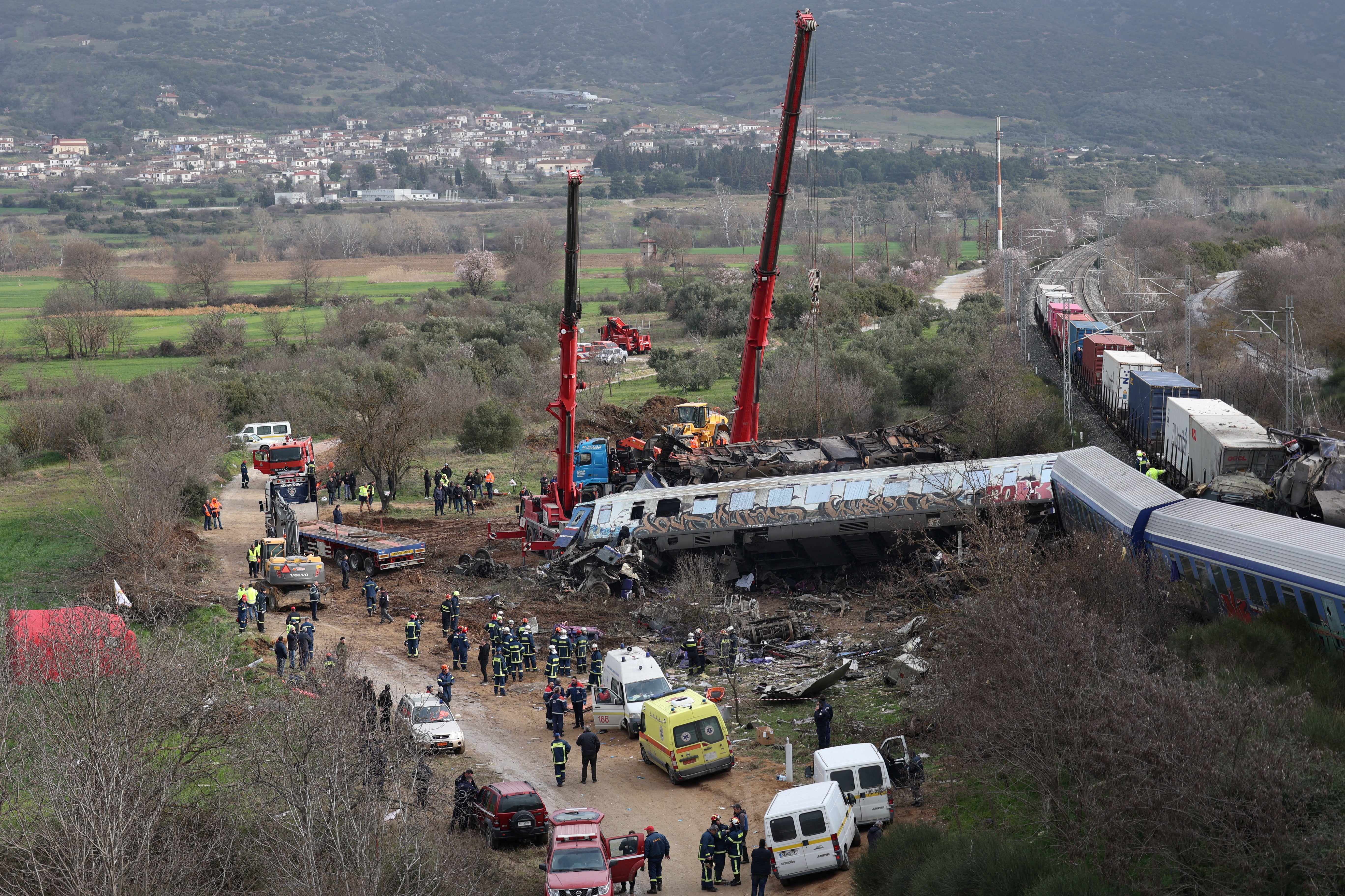 Rescuers operate at the site of a crash, where two trains collided, near the city of Larissa, Greece