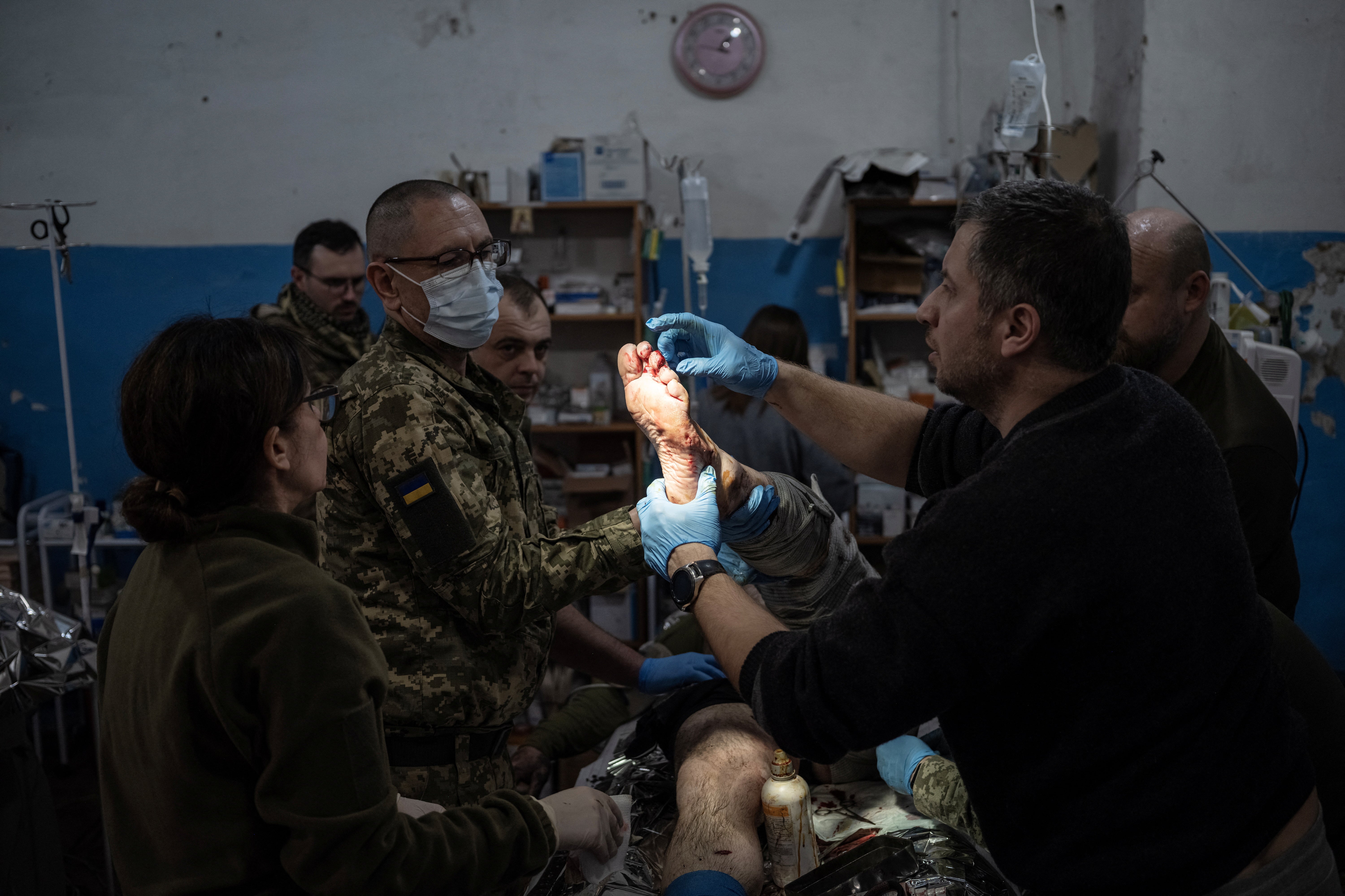 A soldier is treated in the operation room