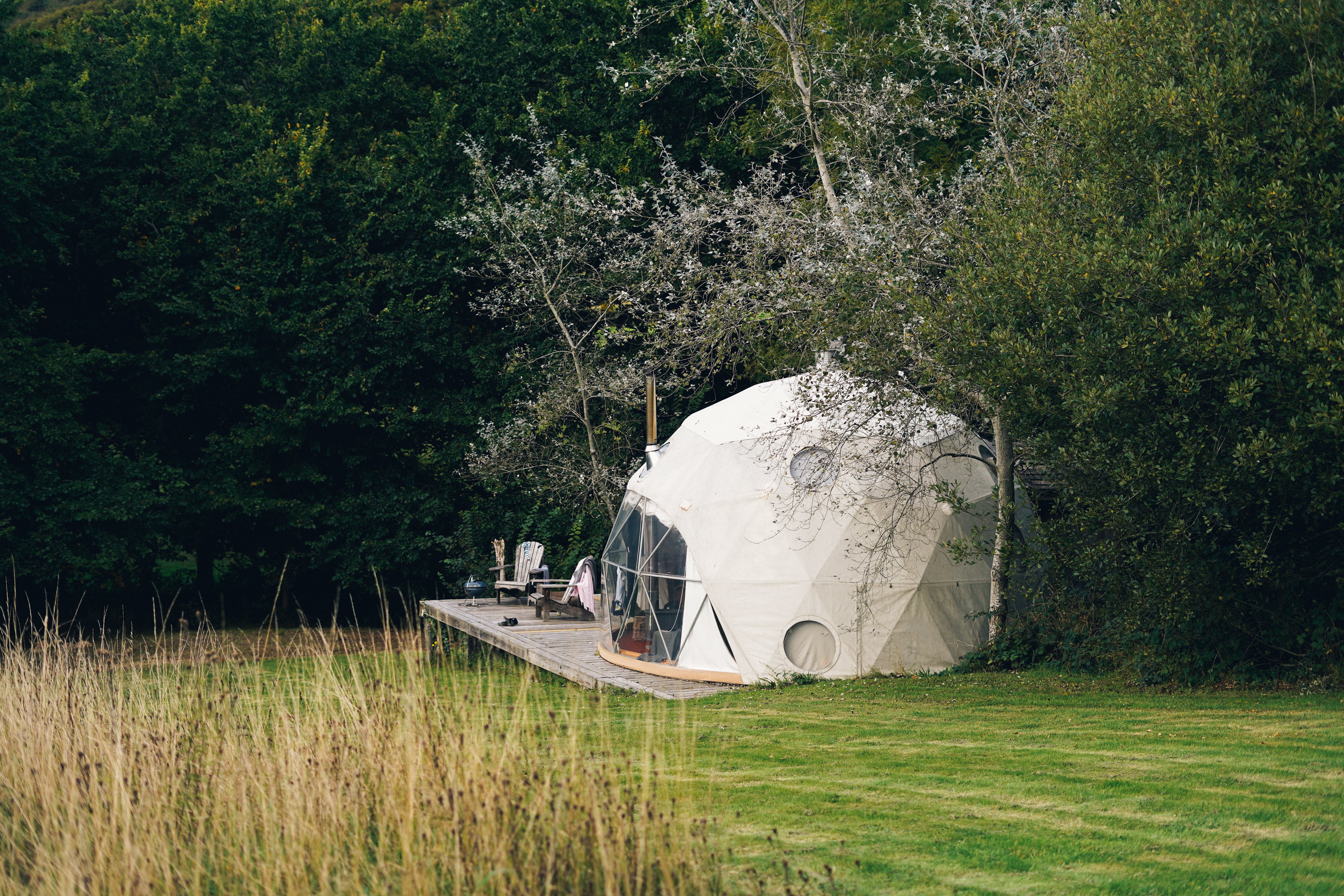 Choose between a cabin or dome for your signal-free stay