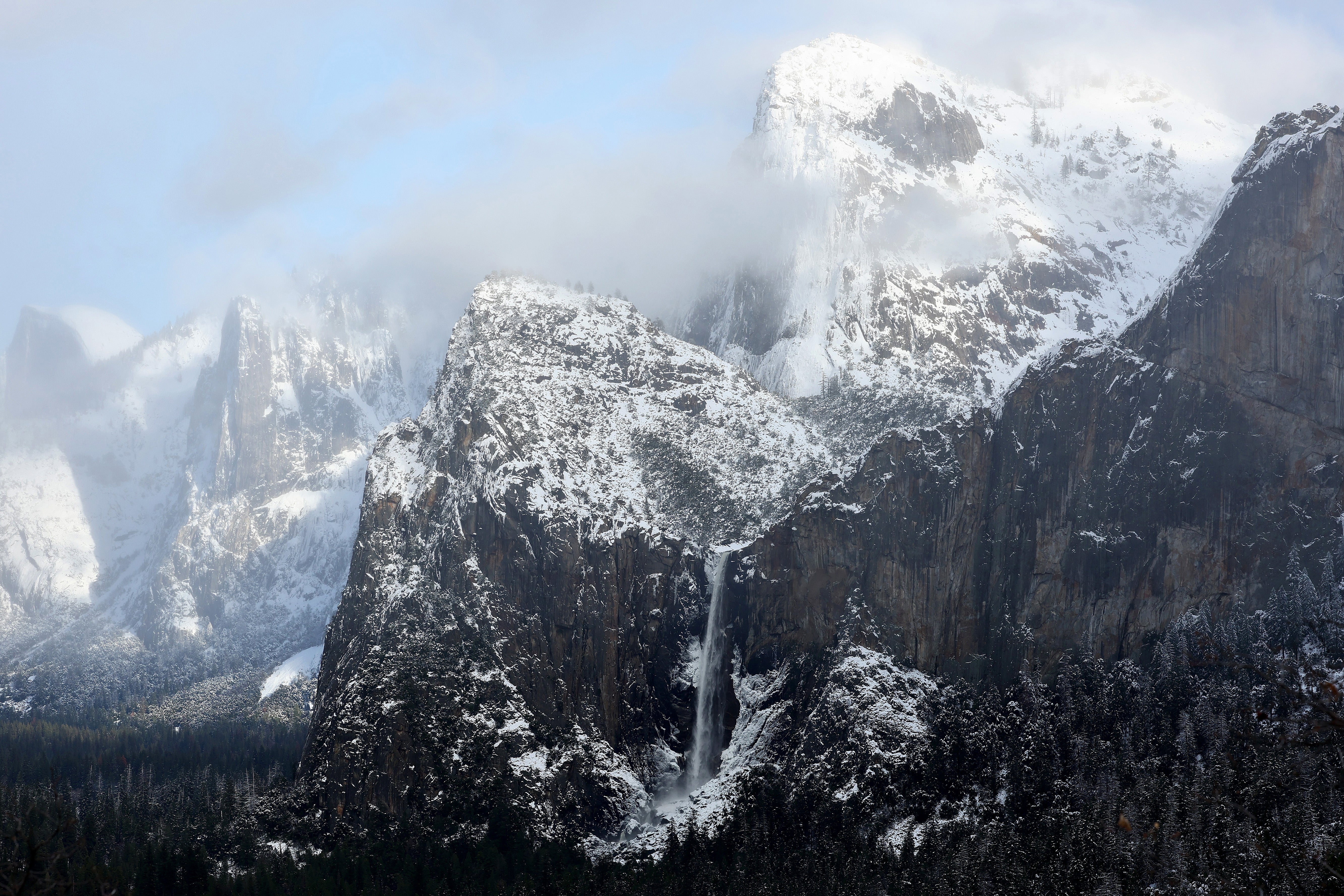 Water flows from Bridalveil Fall (LOWER C) in Yosemite Valley, after the last of a series of atmospheric river storms passed through, on January 19, 2023 in Yosemite National Park, California