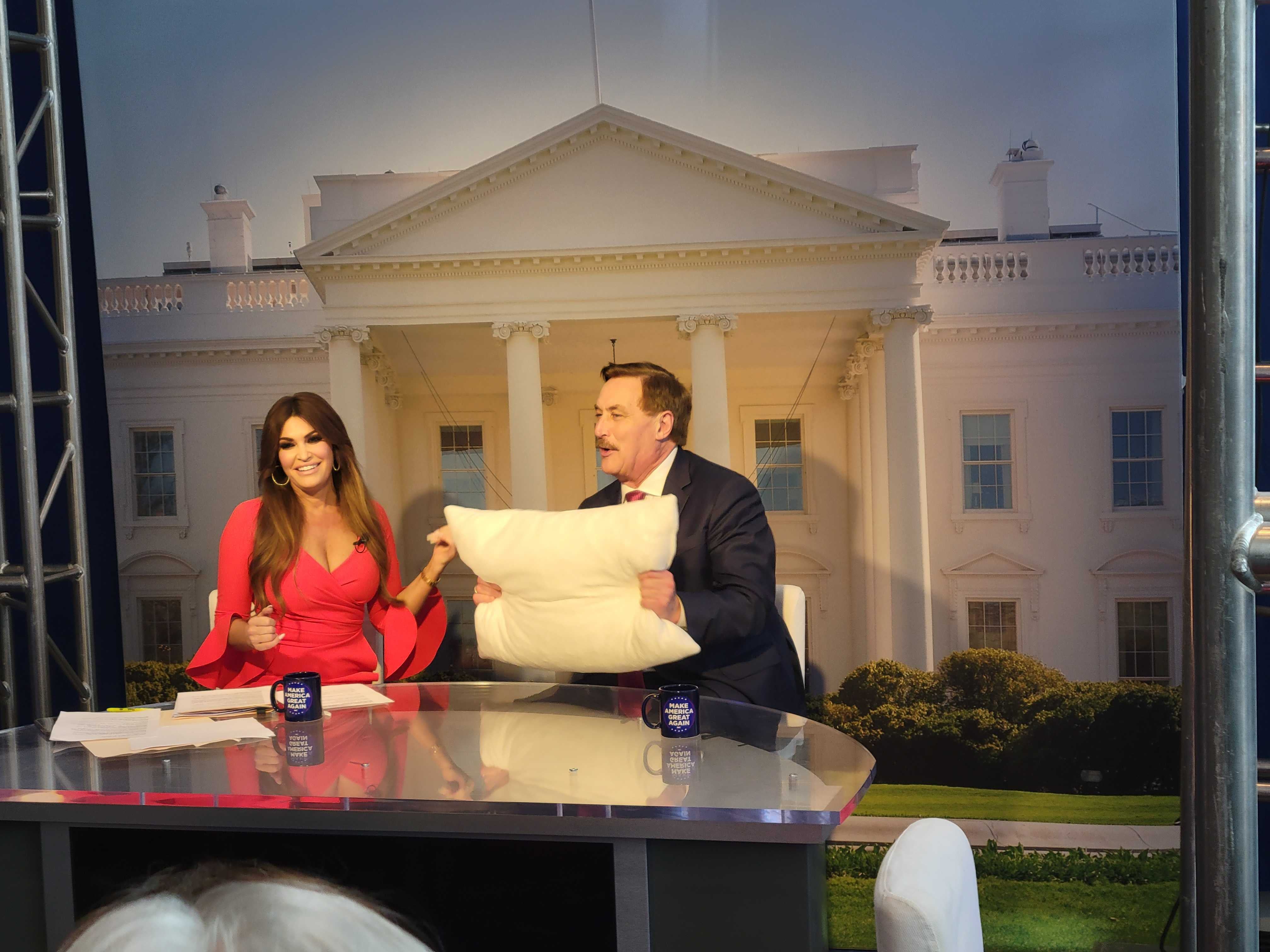 Former Trump adviser and Donald Trump Jr’s fiancee Kimberly Guilfoyle poses with election conspiracy theorist Mike Lindell at CPAC on 2 March 2023.