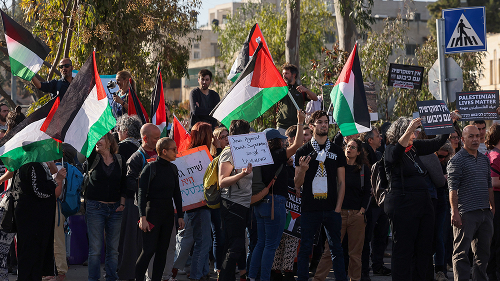 Israeli peace activists raise Palestinian flags in solidarity, on 3 March 2023. Such displays in the UK ‘may not be legitimate’ according to the home secretary