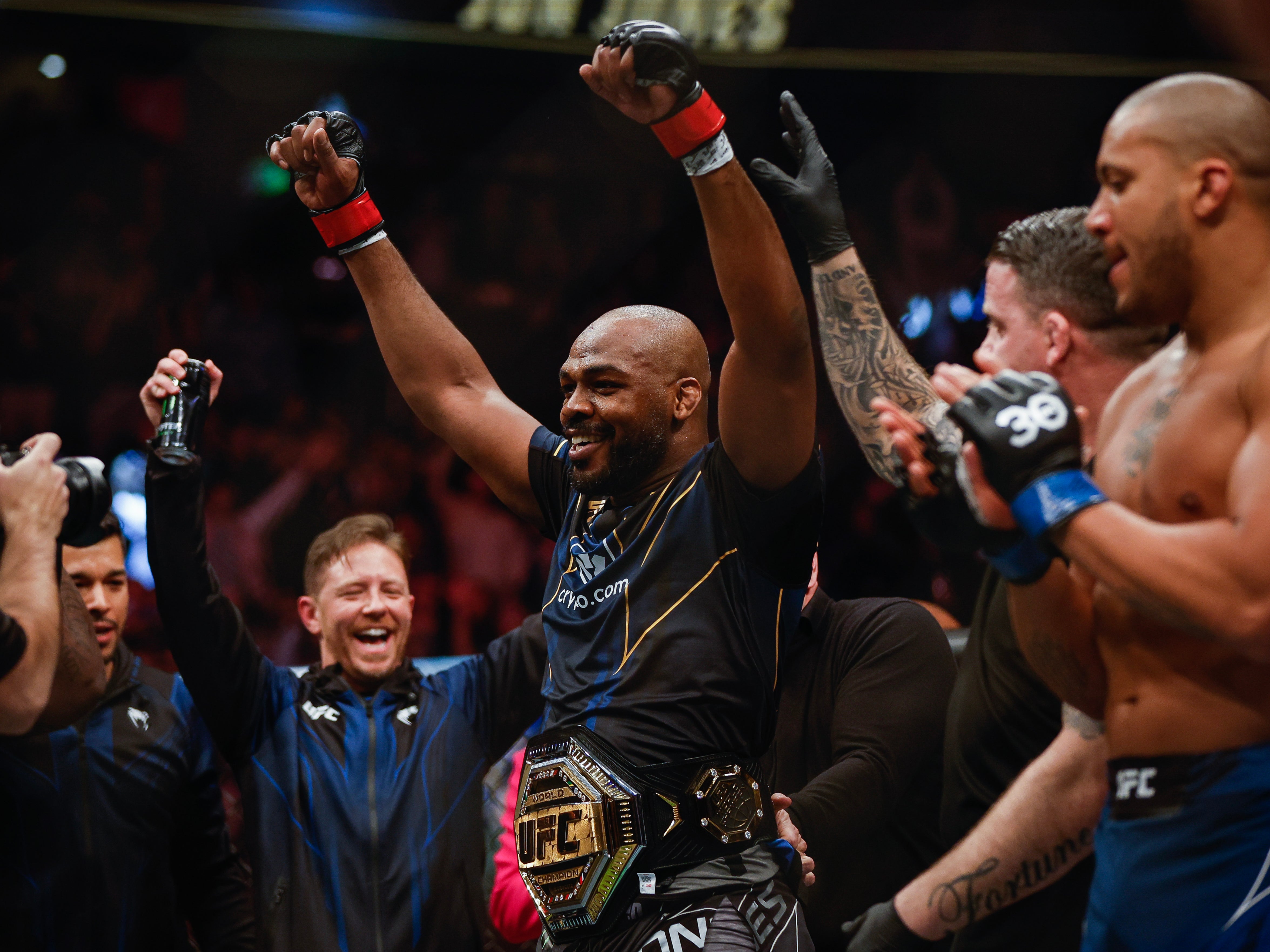 Jon Jones celebrates winning the UFC heavyweight title in March