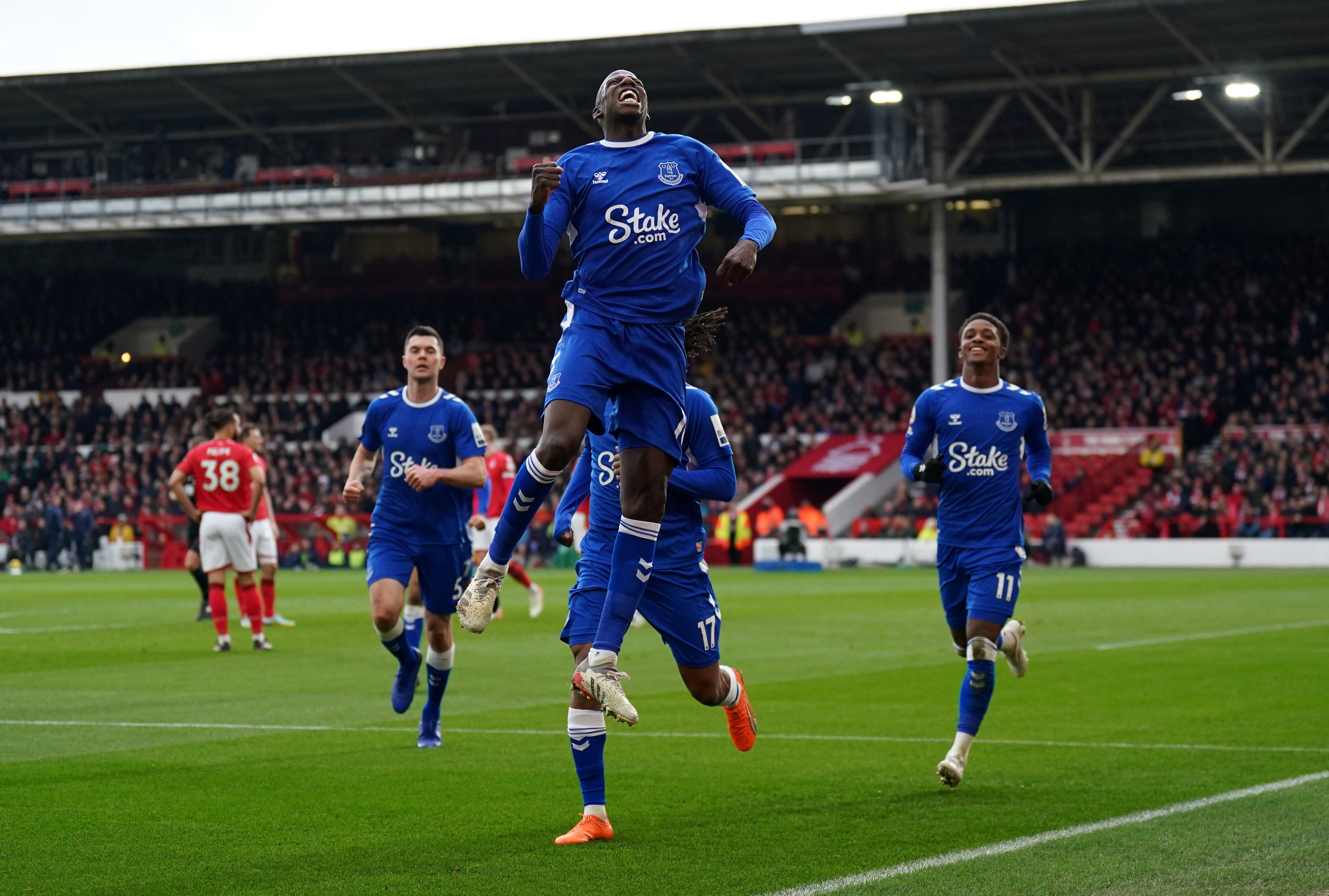 Abdoulaye Doucoure leaps in celebration after putting Everton back in the lead