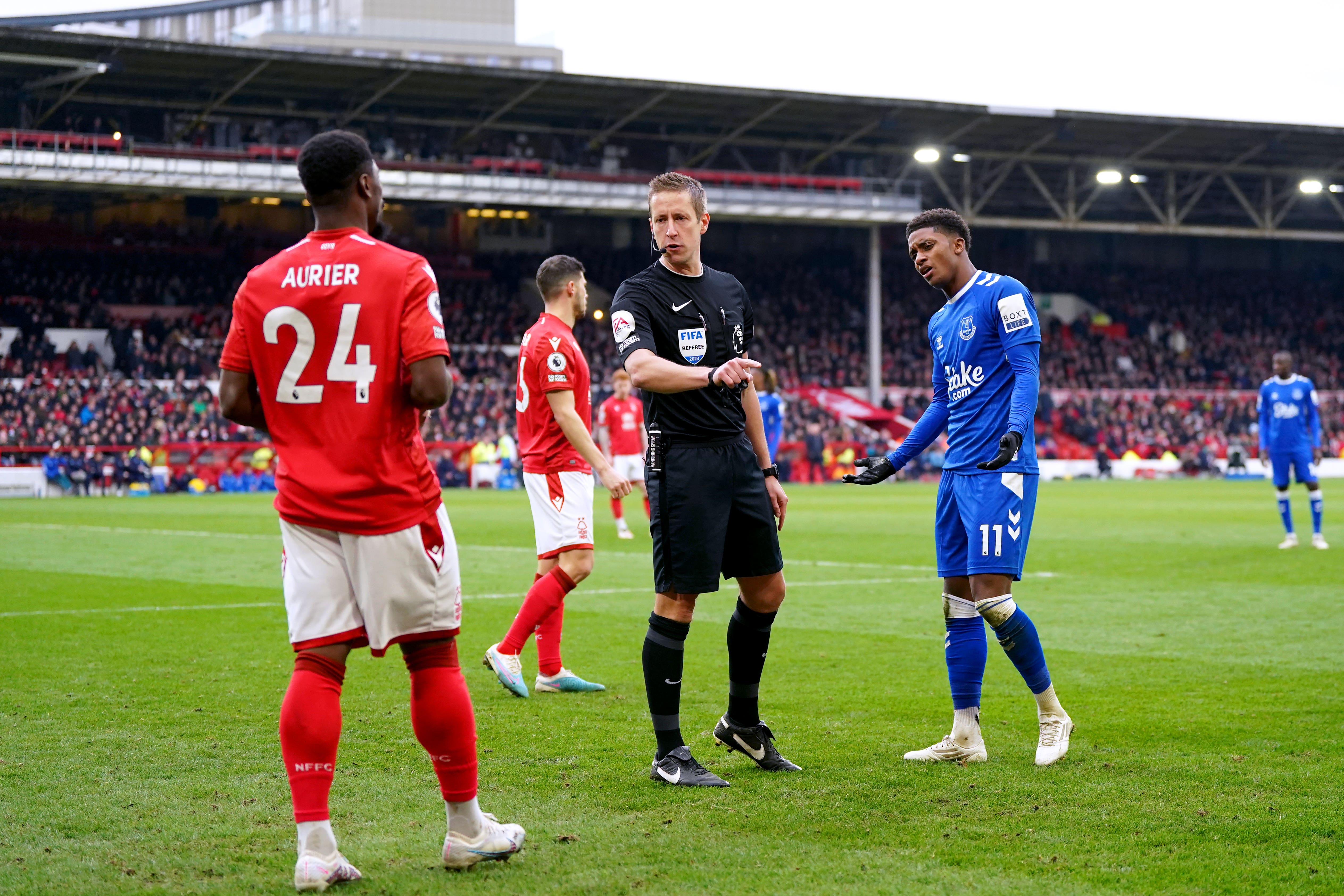 John Brooks speaks to Everton’s Demarai Gray (right) and Nottingham Forest’s Serge Aurier (Nick Potts/PA)