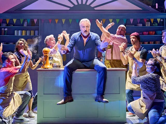 <p>John Owen-Jones as Phil Hollinghurst with contestants in ‘The Great British Bake Off Musical’ </p>